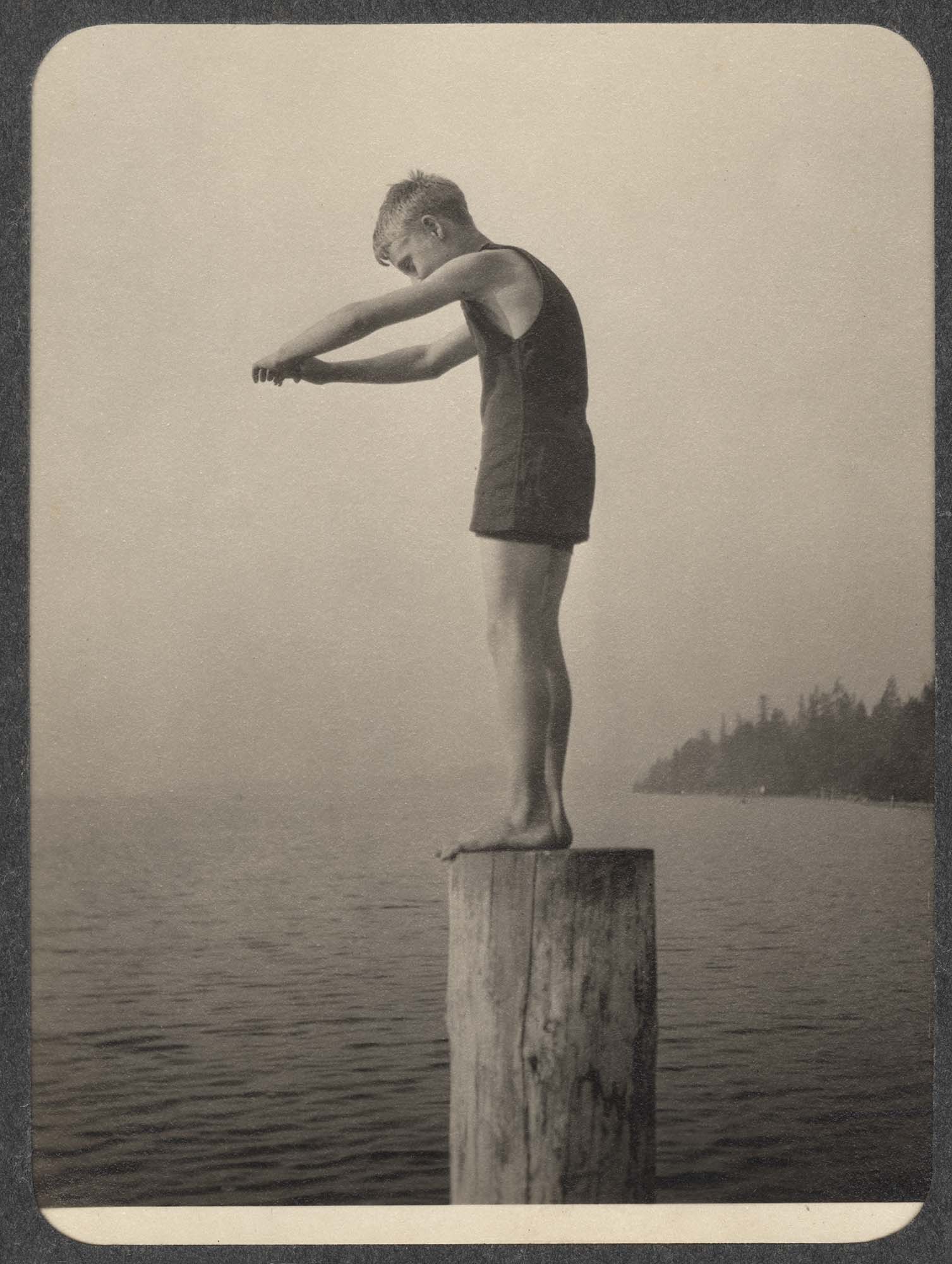 Image of Boy standing on post posed to dive, Beaux Arts Village, Washington, ca. 1910