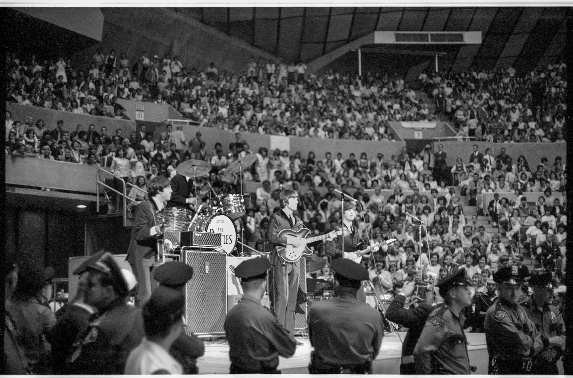 Image of The Beatles onstage at the Seattle Center Coliseum, August 21, 1964