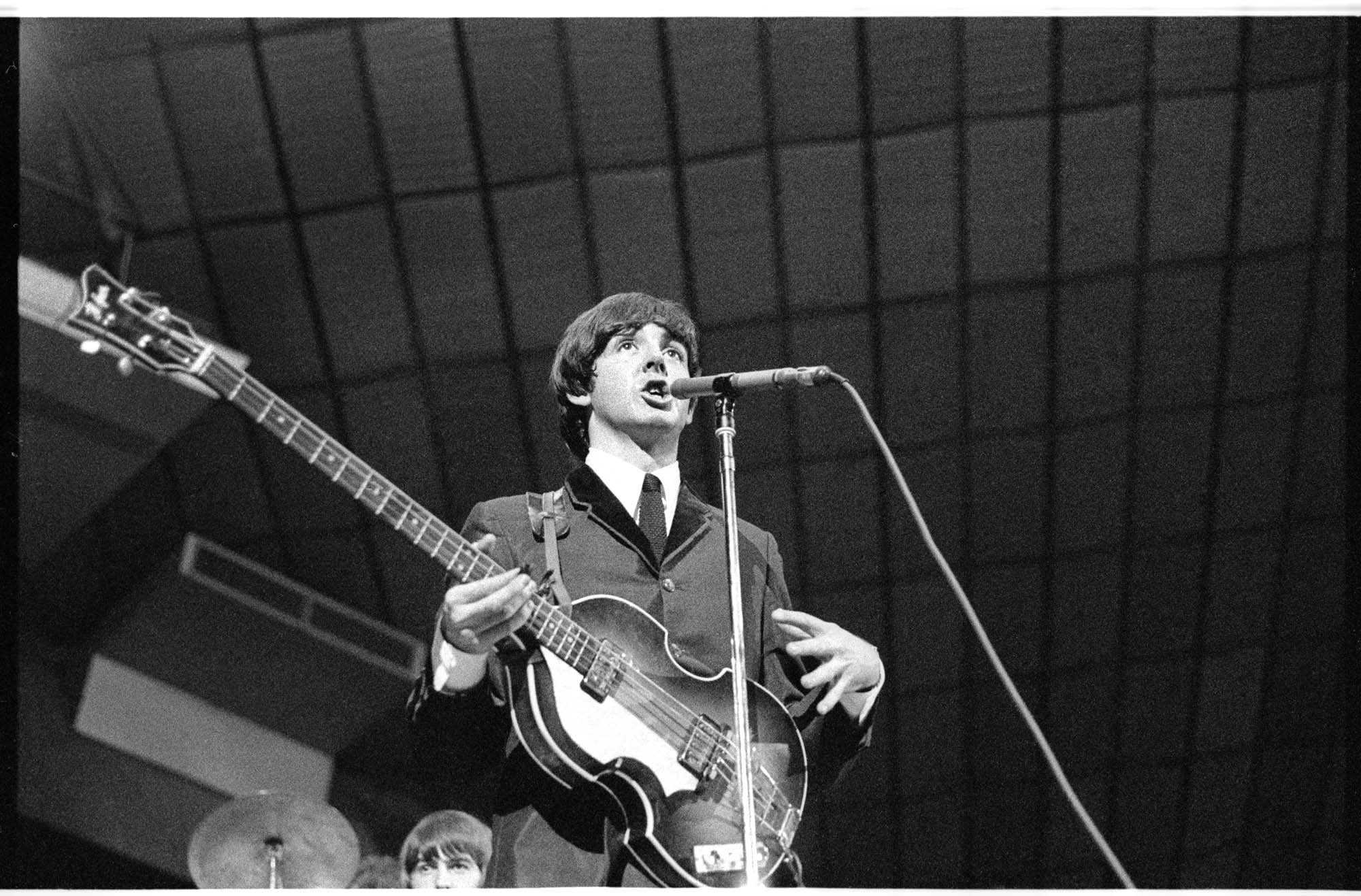 Image of Paul McCartney singing during Beatles concert, Seattle Center Coliseum, August 21, 1964