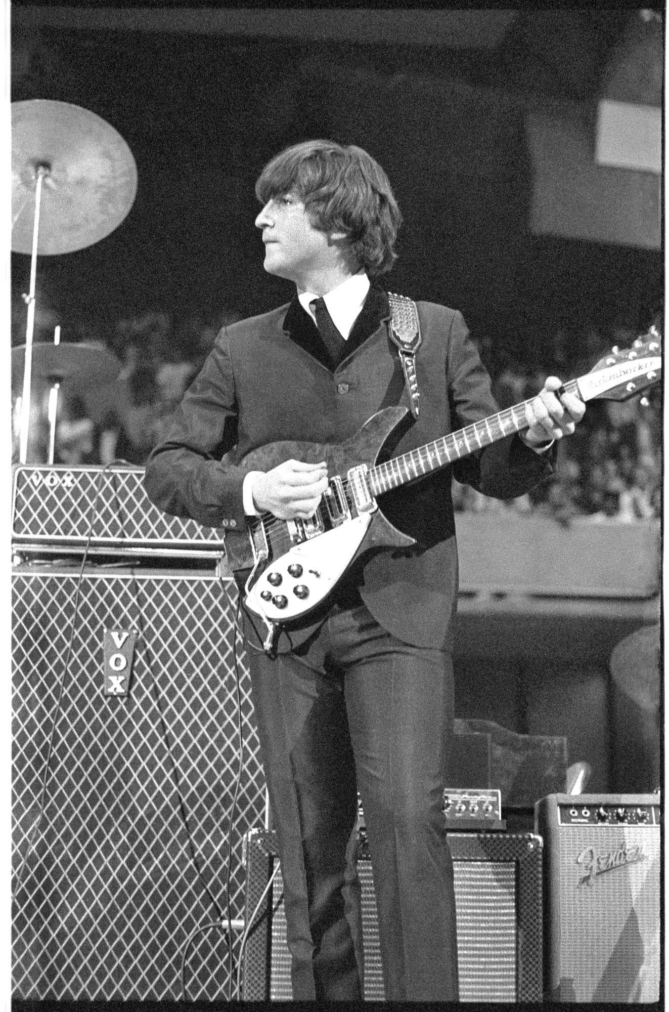 Image of John Lennon performing at the Beatles concert, Seattle Center Coliseum, August 21, 1964