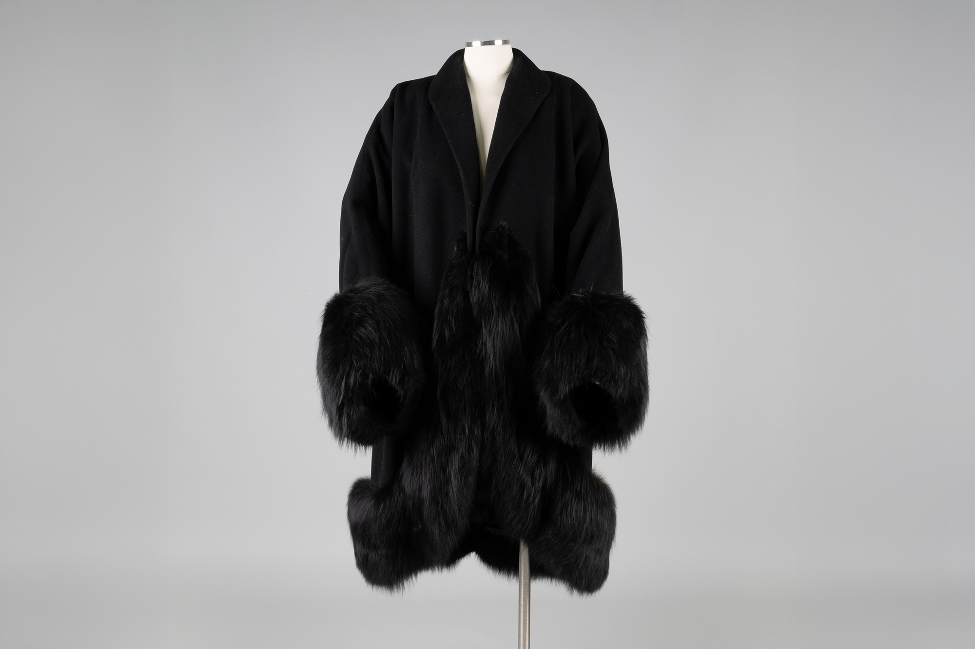 Image of Black coat with fur trim from Best's Apparel, ca. 1940s