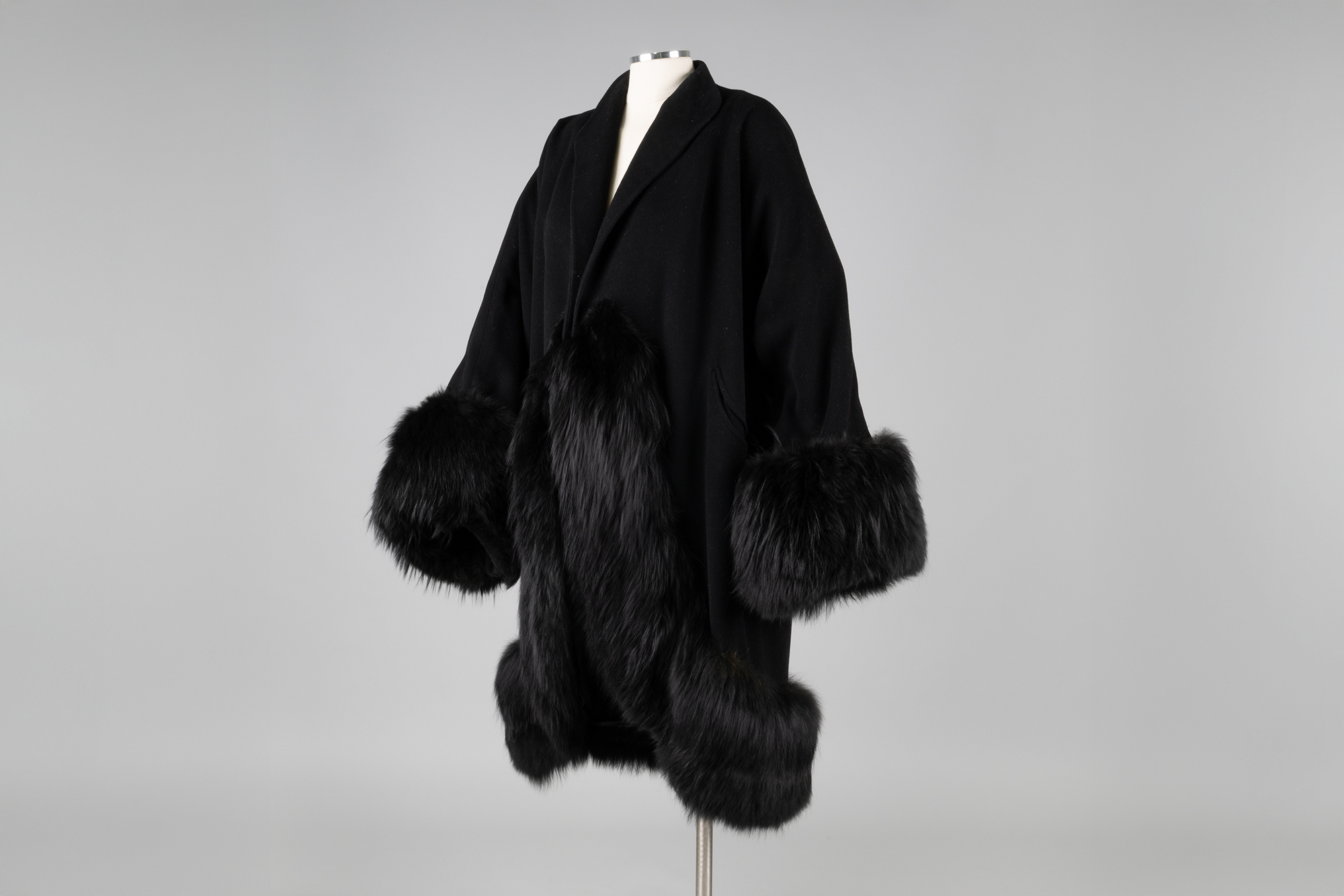 Image of Black coat with fur trim from Best's Apparel, ca. 1940s