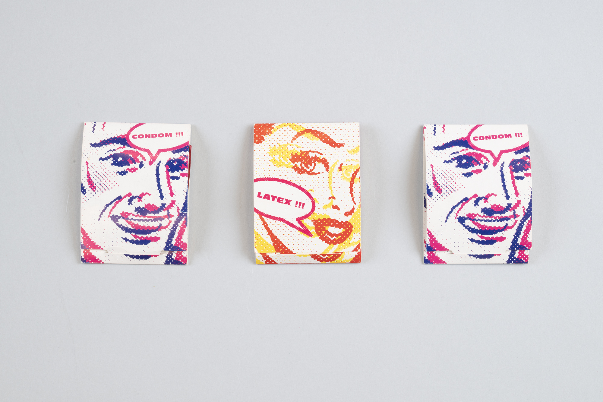 Image of Three condom packs from the Northwest AIDS Foundation, ca. 1992