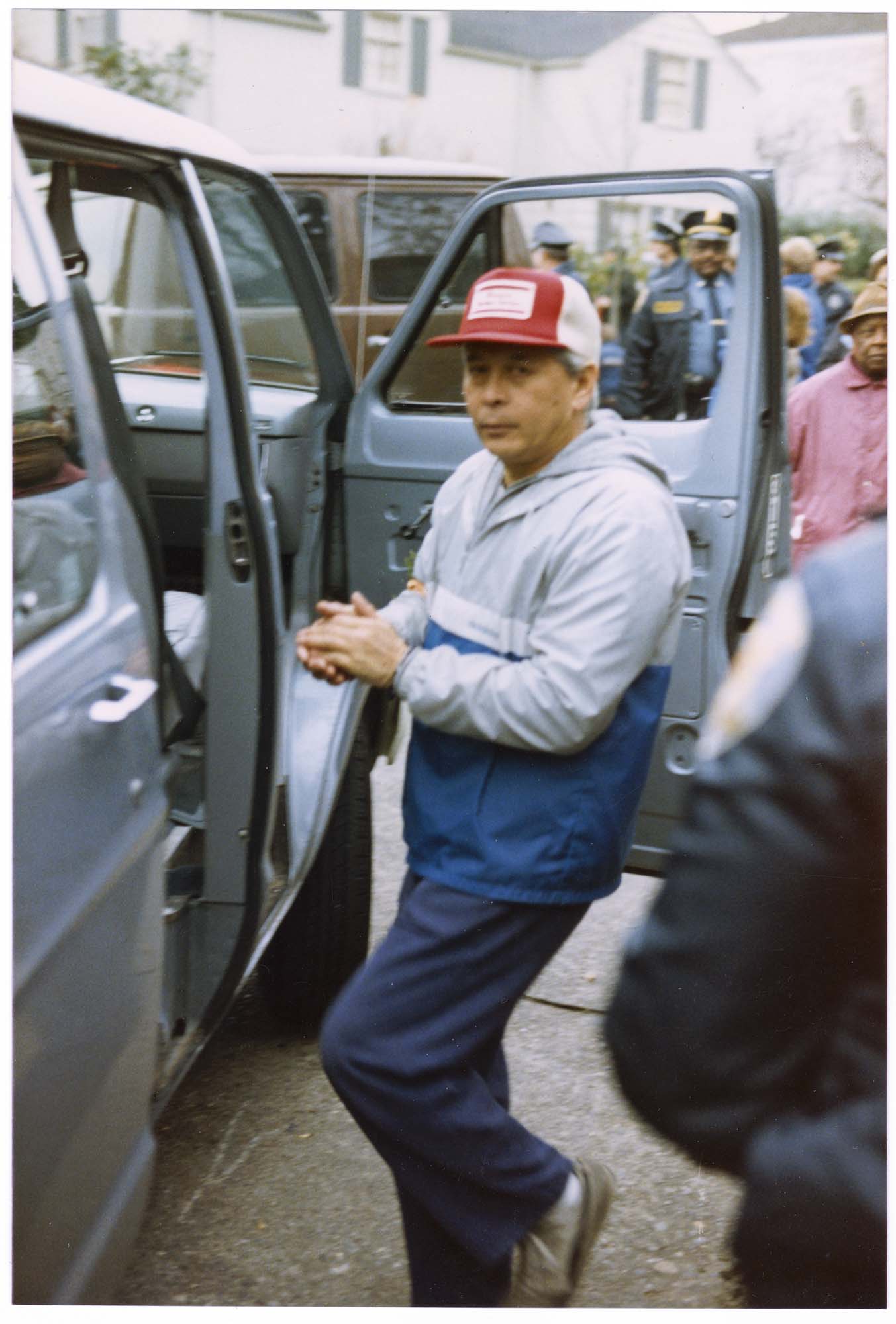 Image of Bob Santos entering police van at protest at the South African consulate, Seattle, December 9, 1984