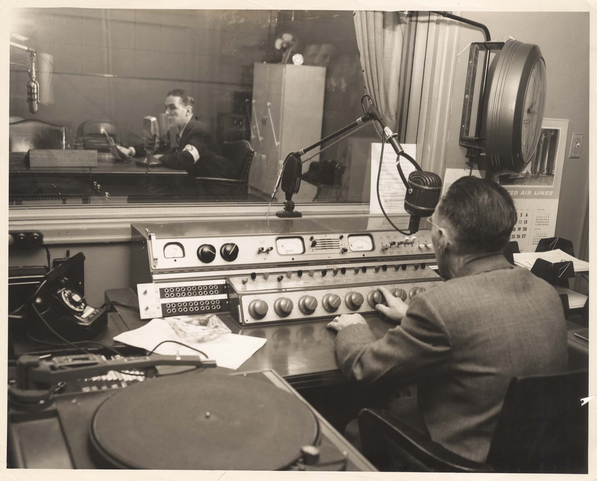 Image of Two men in KIRO Radio broadcast booths, Seattle,  circa 1945