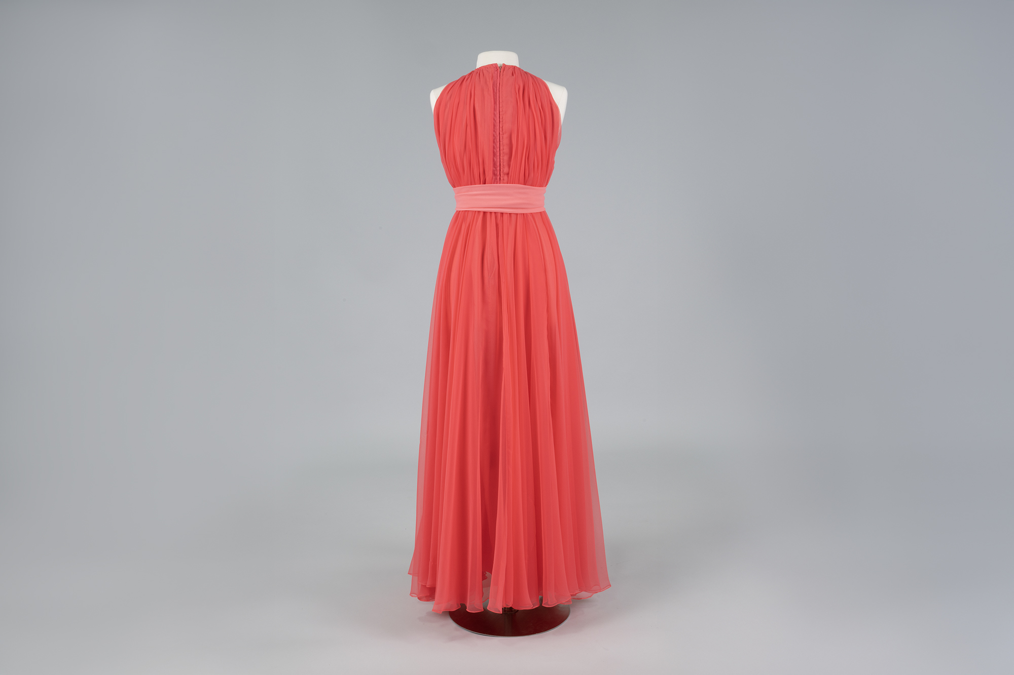 Image of Pink chiffon gown and cape designed by Kiki Hart, 1970s