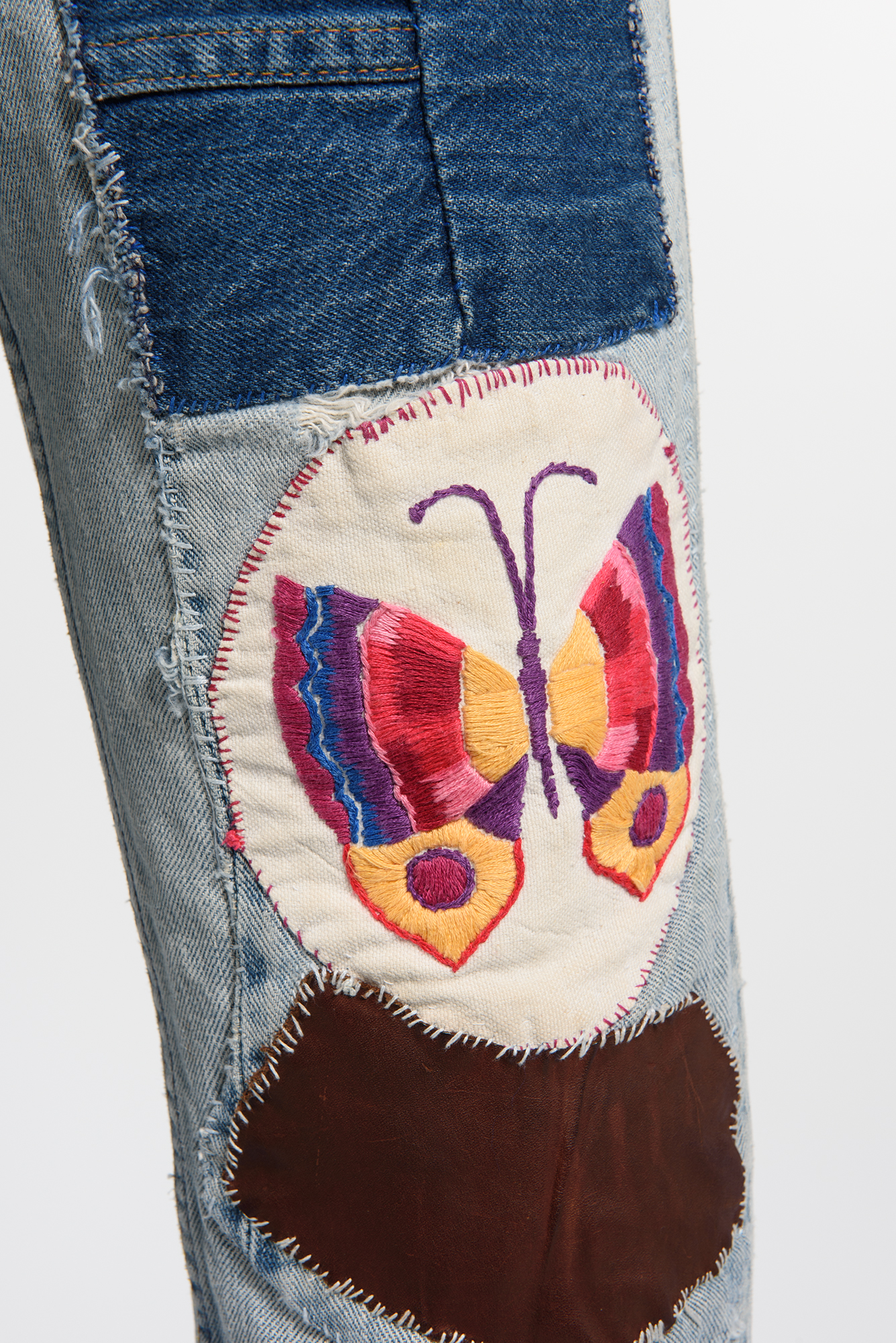 Image of Pair of bell-bottom jeans with patches, 1968-1980