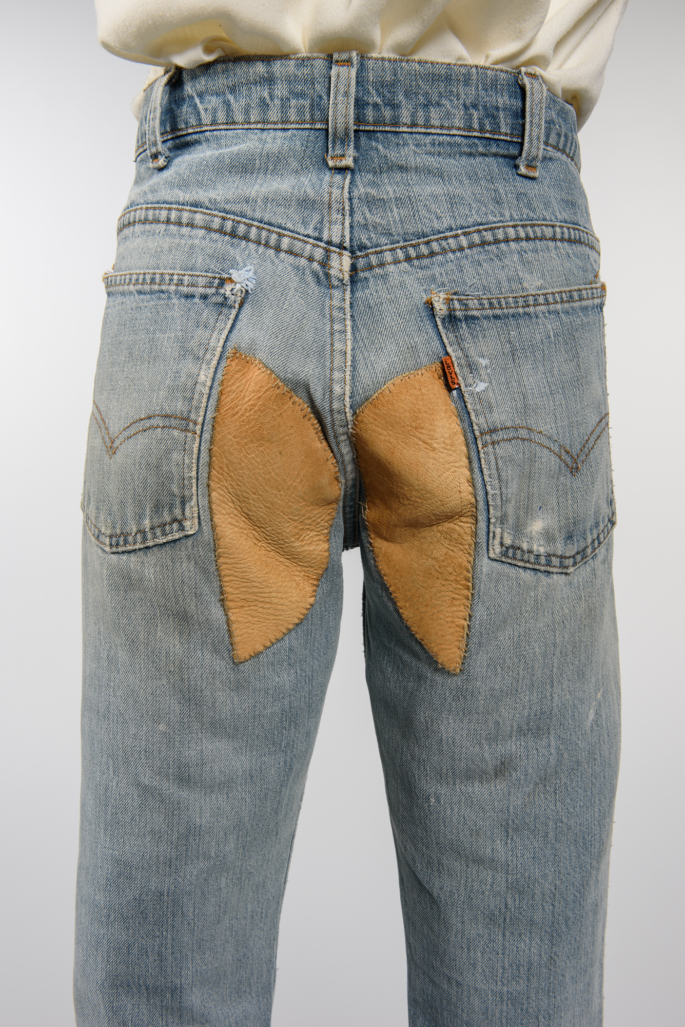 Image of Pair of bell-bottom jeans with patches, 1968-1980