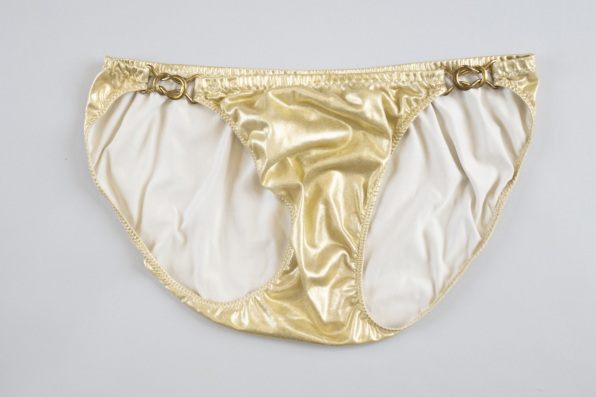 Image of Gold bathing suit worn by Ric Weiland, 1970s