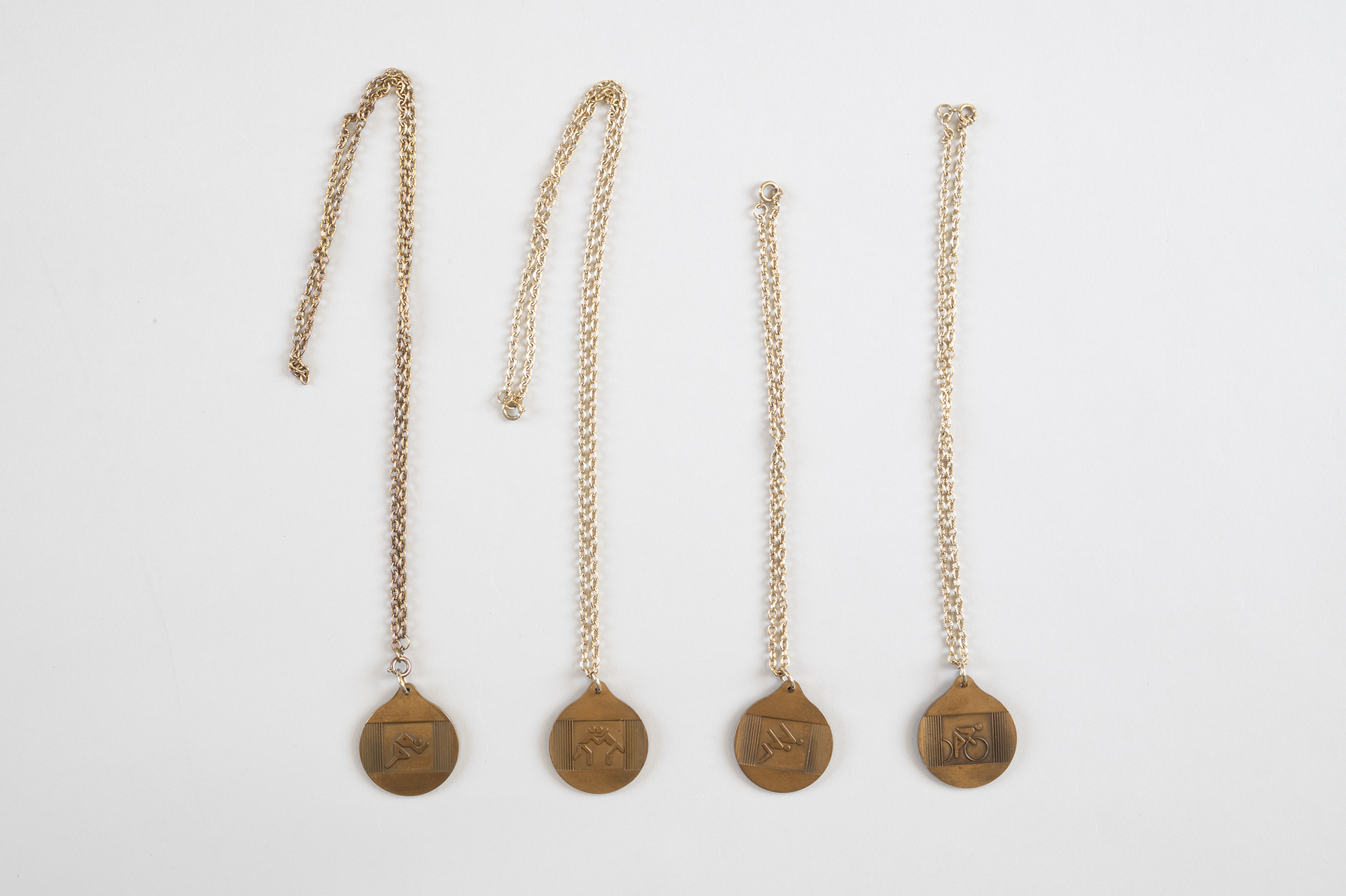 Image of Four small souvenir medals from Montreal 1976 Olympics