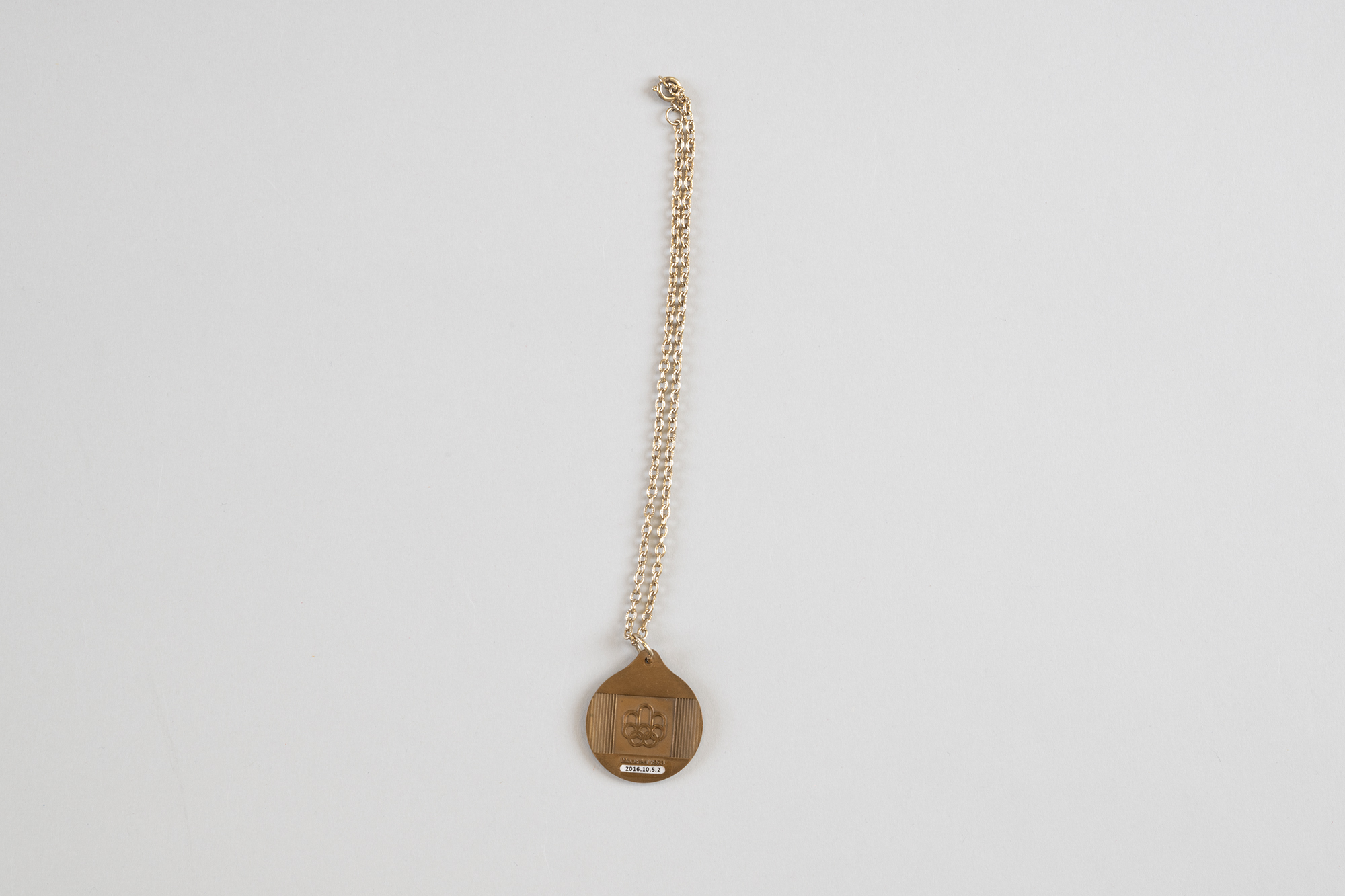 Image of Four small souvenir medals from Montreal 1976 Olympics