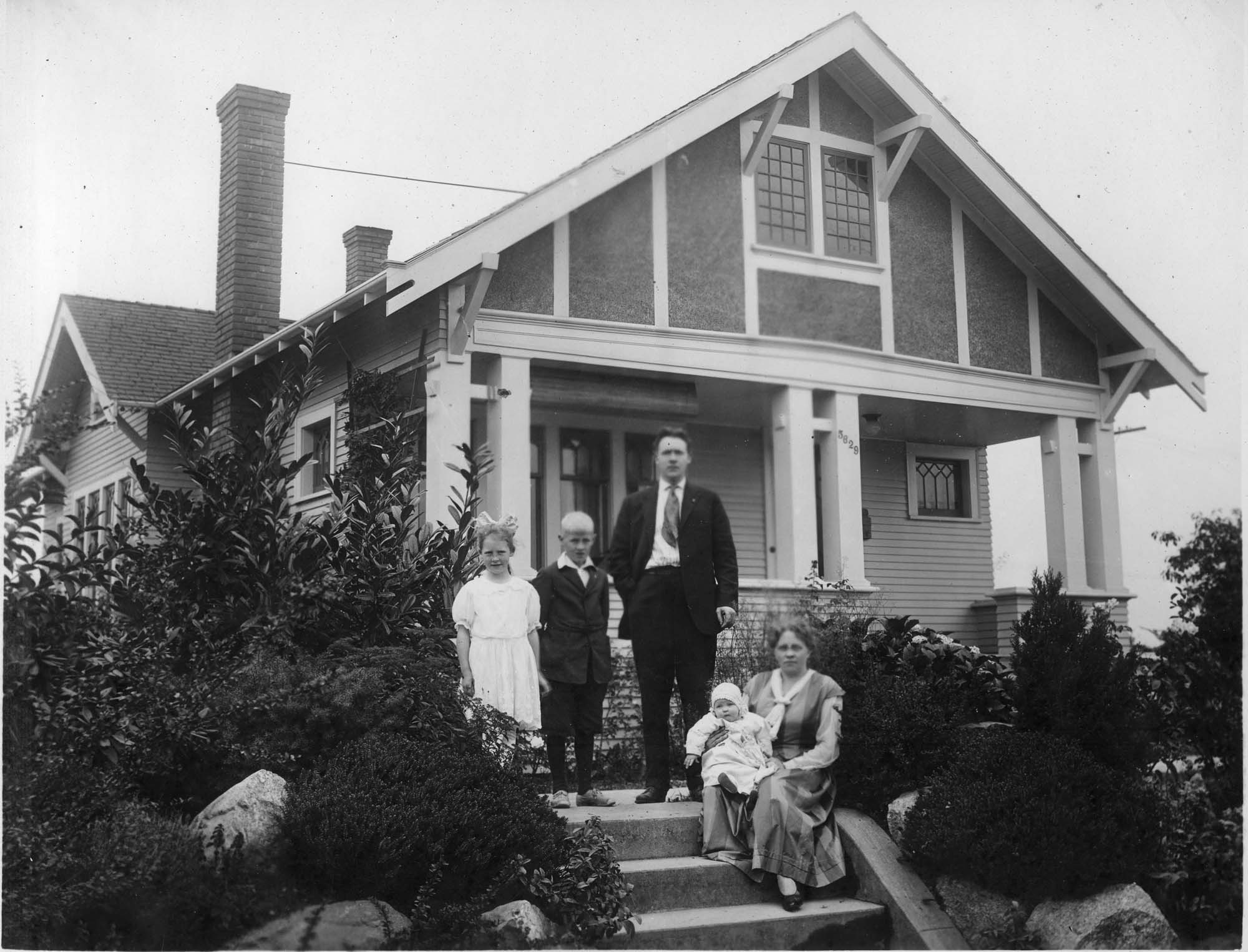 Image of Swedish-American family on porch of house, circa 1925