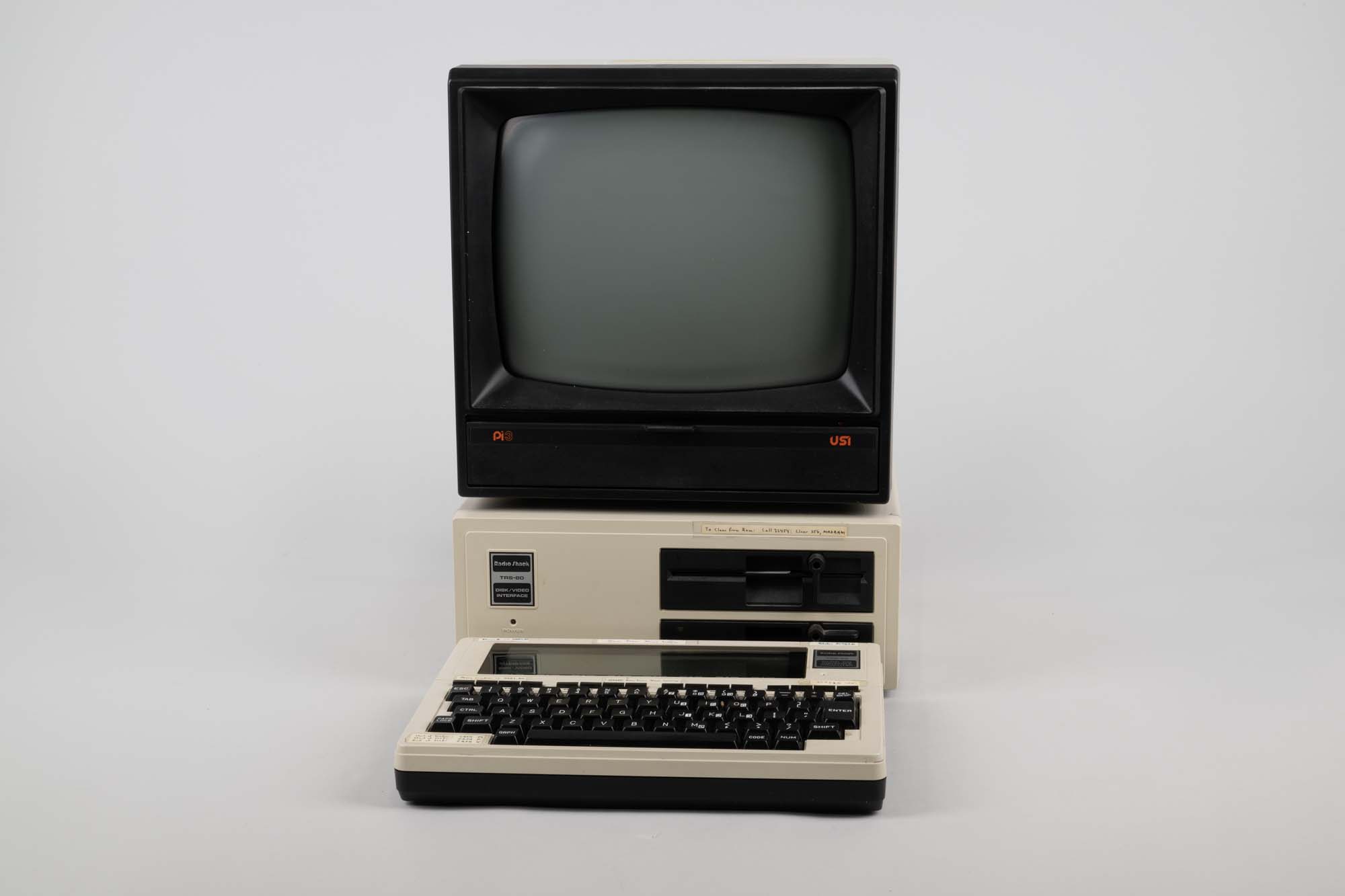 Image of TRS-80 Model 100 portable computer and peripherals, ca. 1983