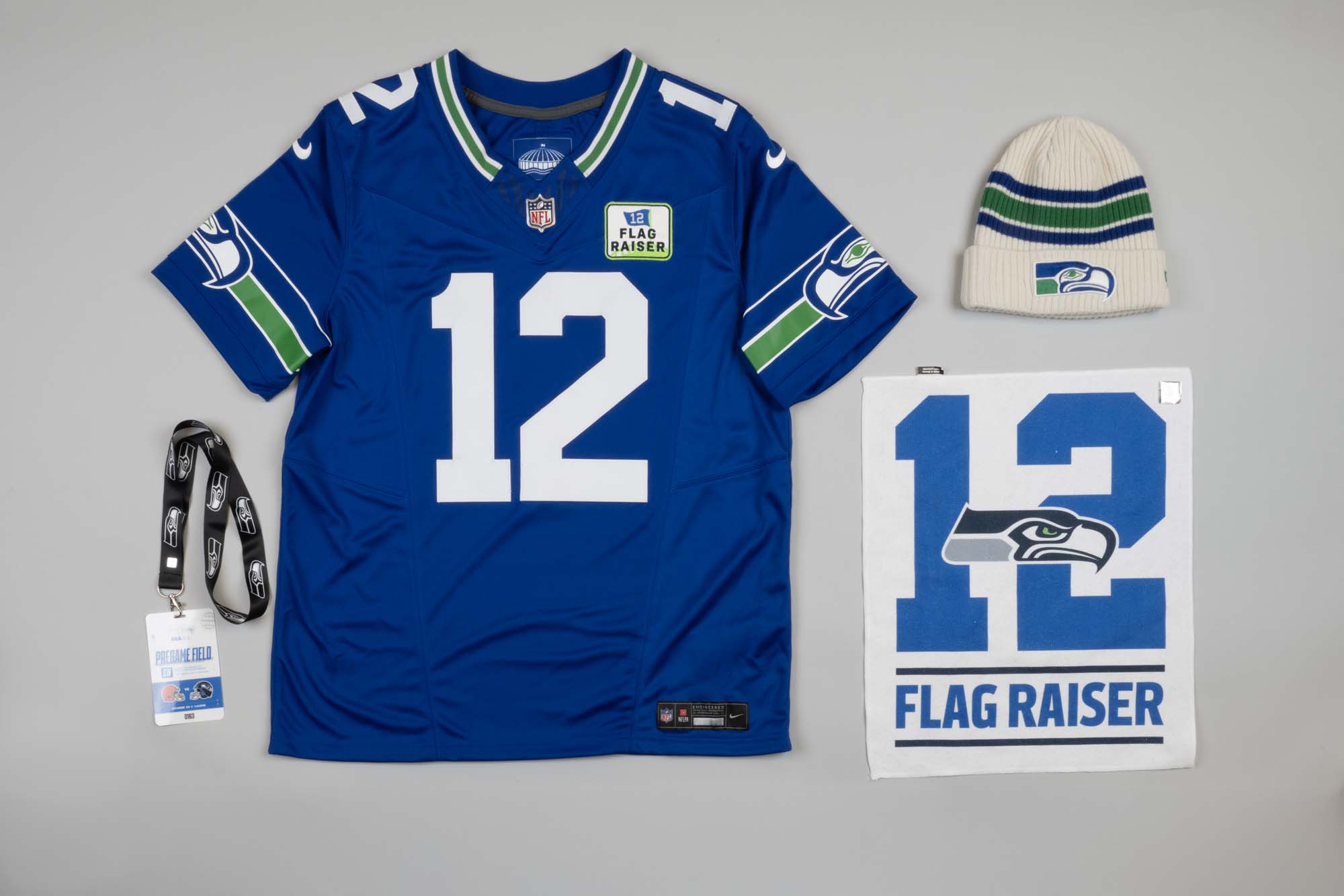 Image of Bill Nye’s jersey, cap, towel, and badge from 12th man flag raising, Nov. 19, 2023