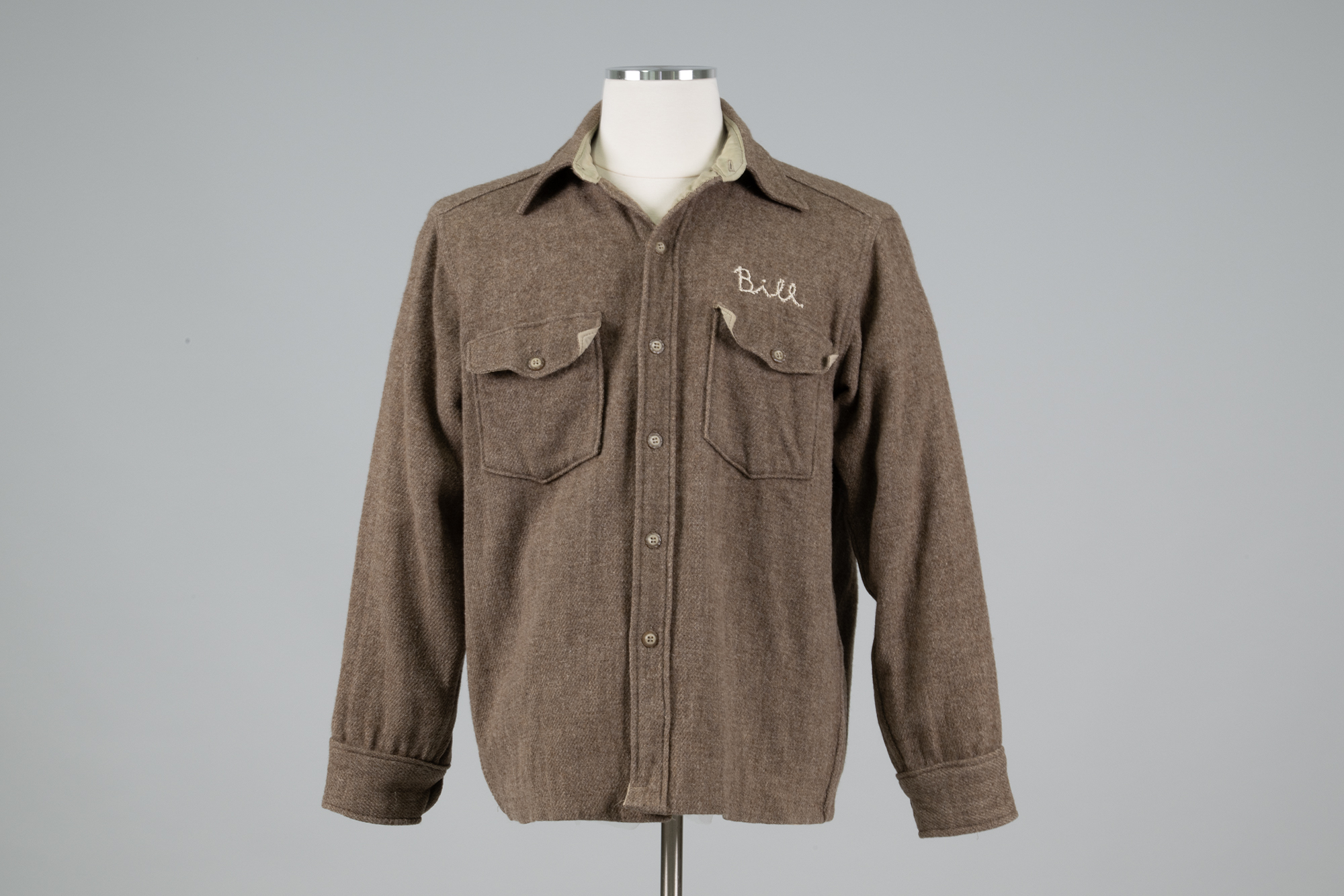 Image of Brown wool shop coat from REI used by Bill Nye, 1980s
