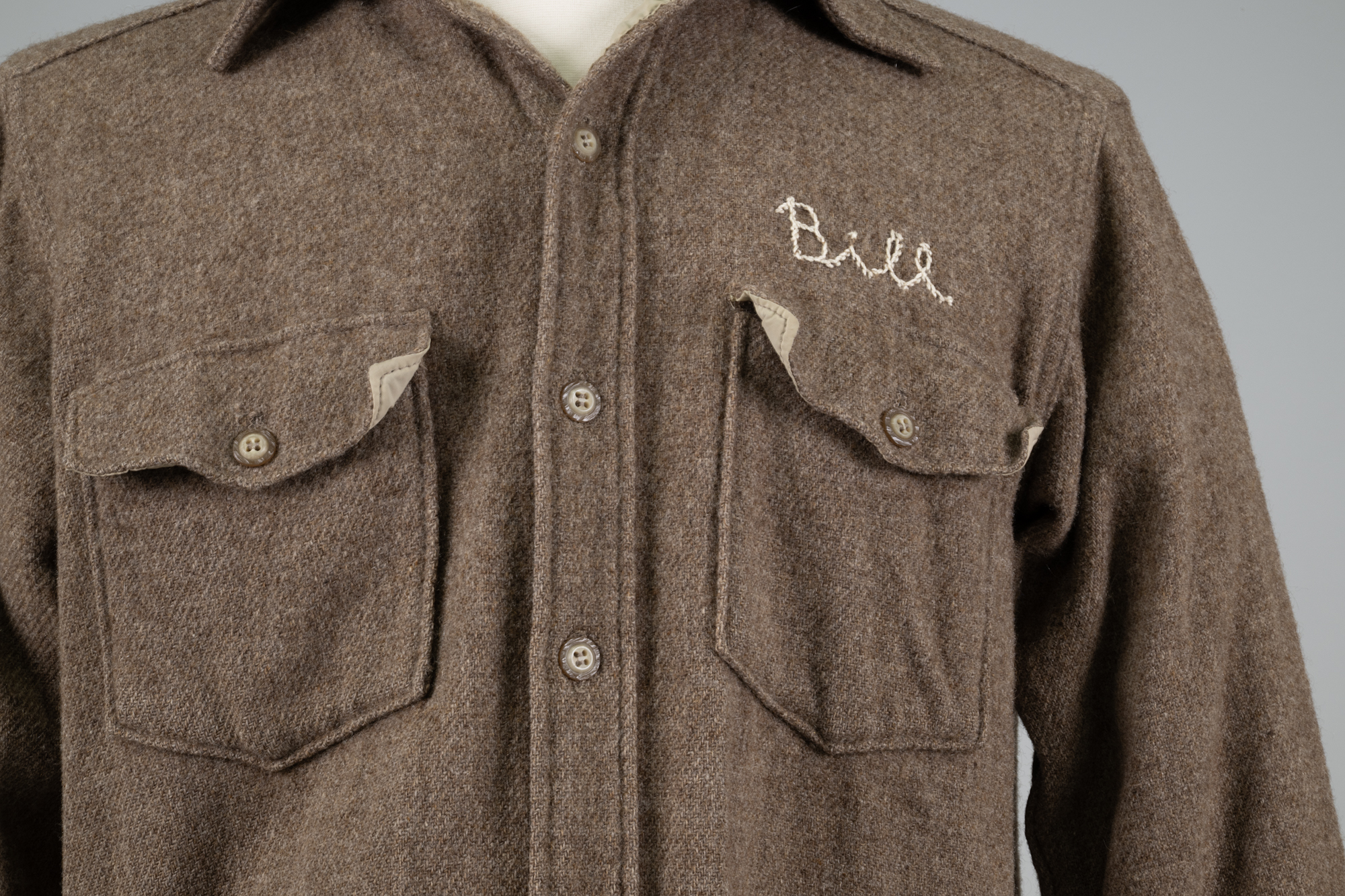 Image of Brown wool shop coat from REI used by Bill Nye, 1980s