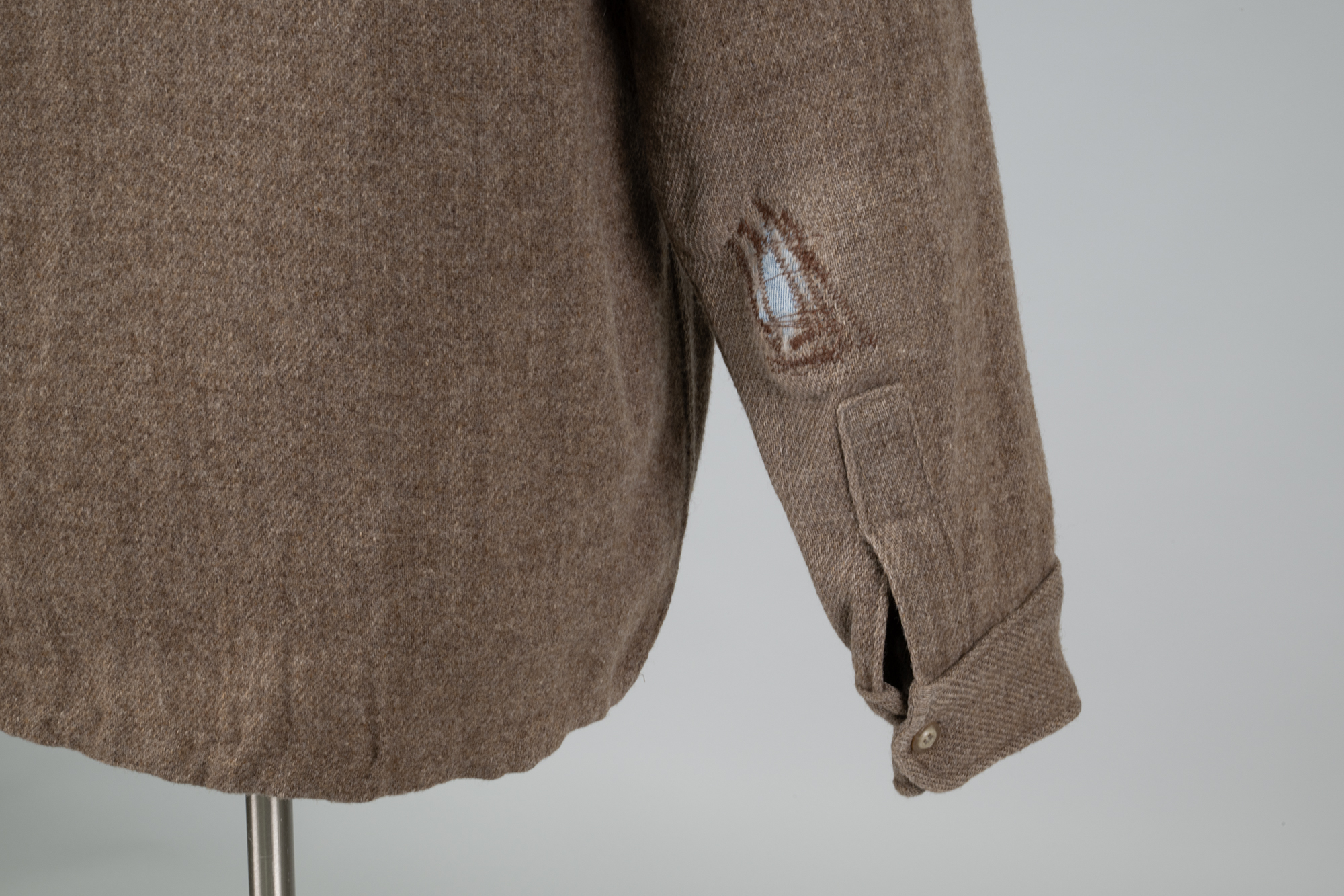 Image of Brown wool shop coat from REI used by Bill Nye, 1980s