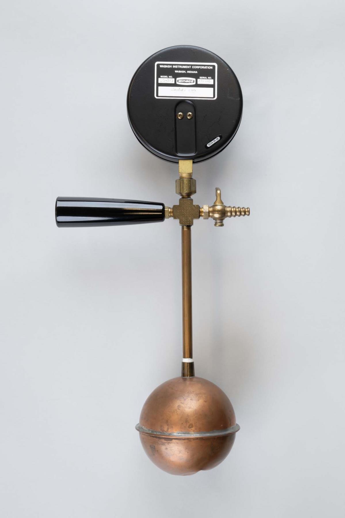 Image of Prop for demonstrating absolute zero, made of a metal toilet float, 1990s