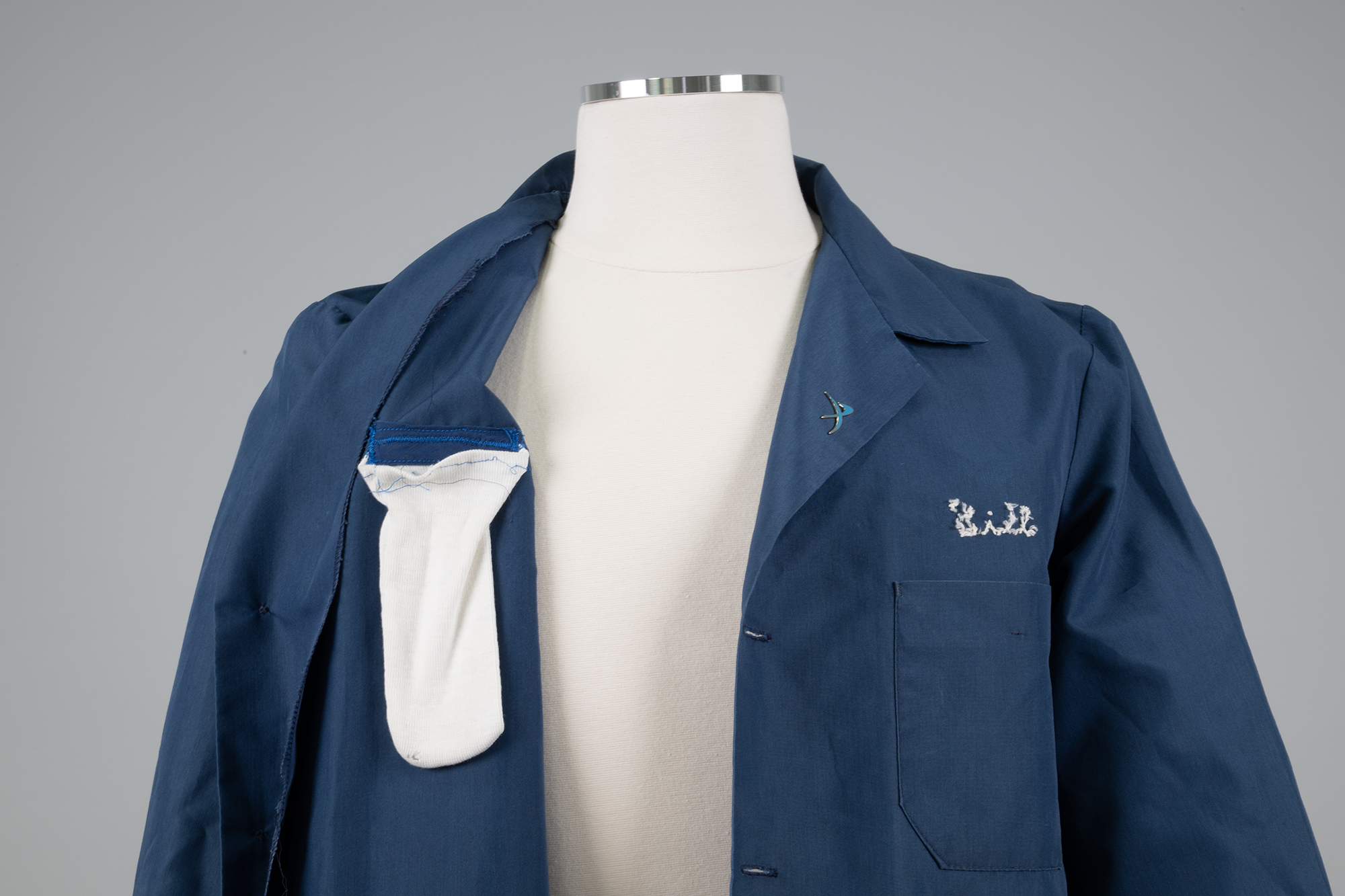 Image of Blue shop coat modified and worn by Bill Nye, 1980s