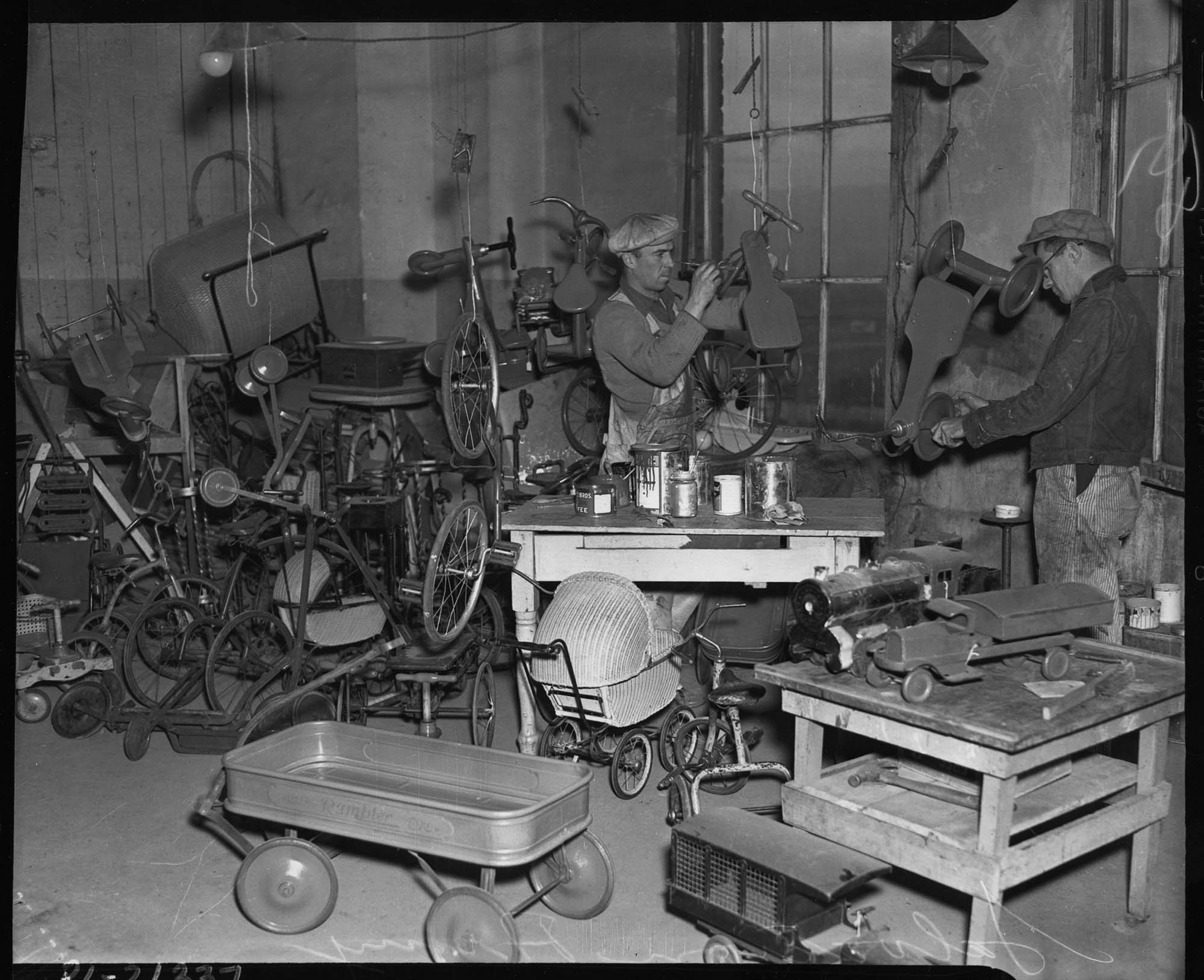 Image of Men working in Salvation Army toy repair shop, 1937