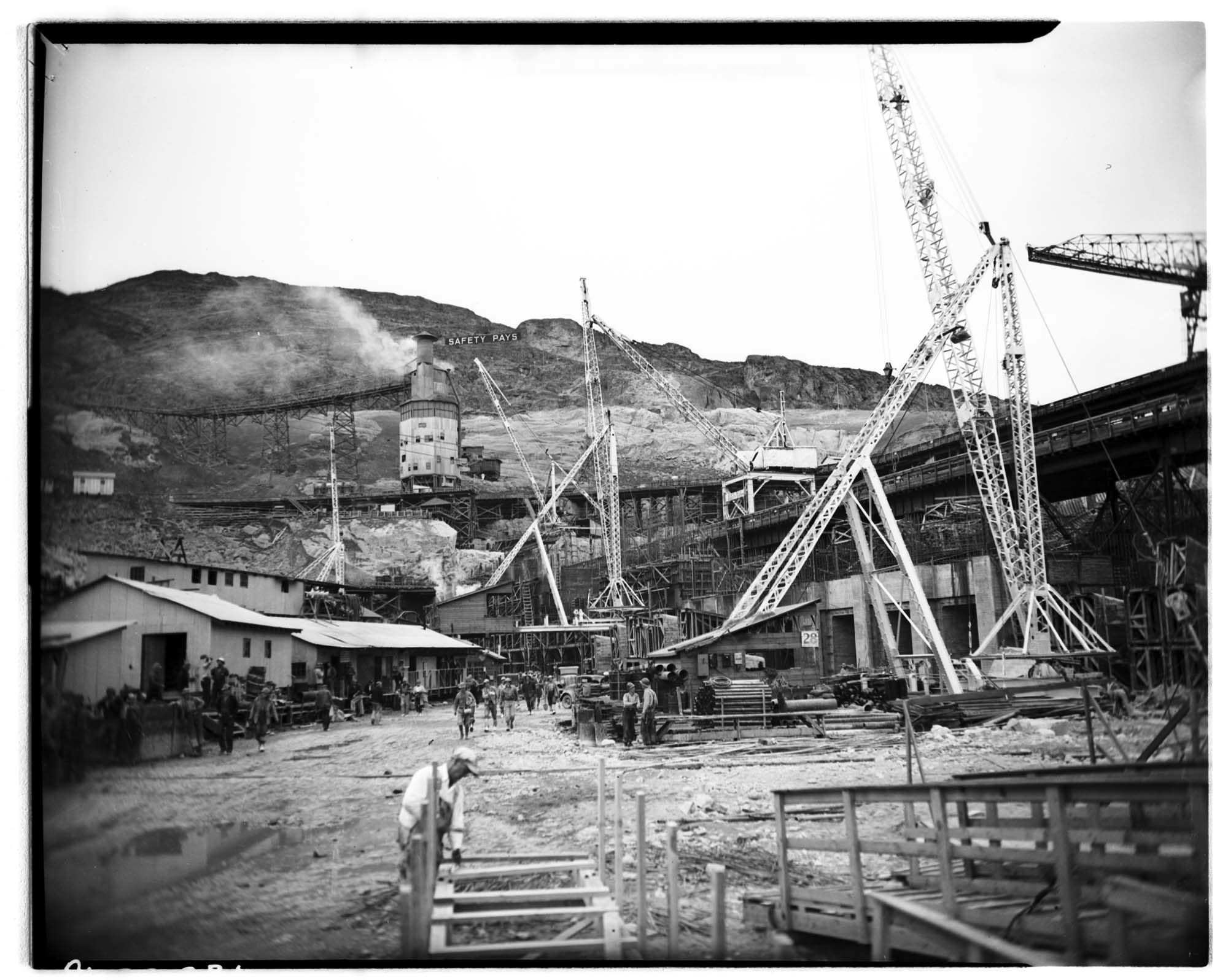 Image of Change of shift at dam construction site, circa 1937