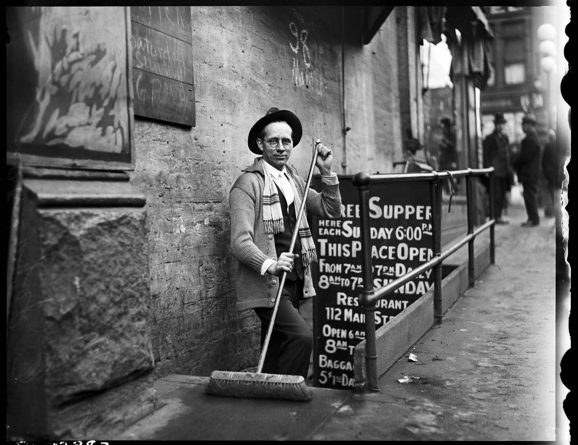 Image of Martin Johanson sweeping steps at The Millionair Club, circa 1925
