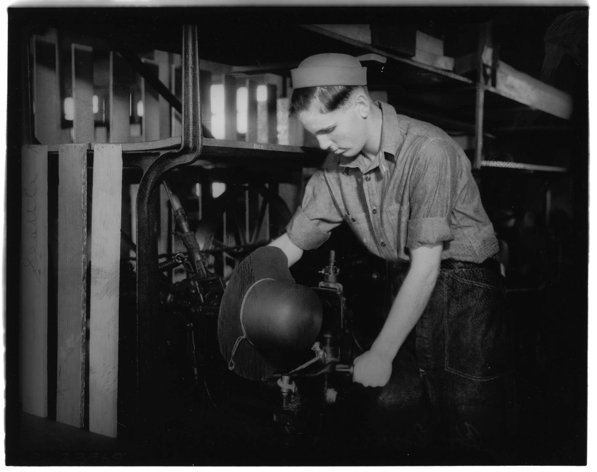 Image of Man shaping a hat at the J.T. Hardeman Hat Company, Seattle, 1935