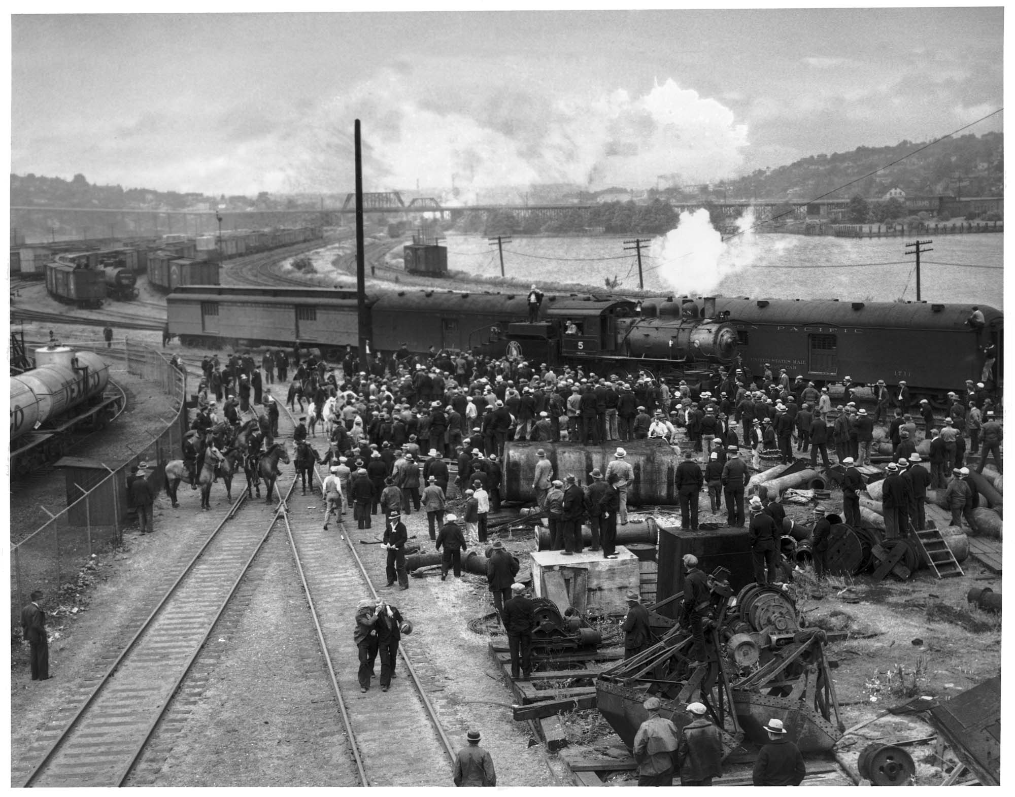 Image of Policemen and striking longshoremen at Pier 40, Seattle, June 1934