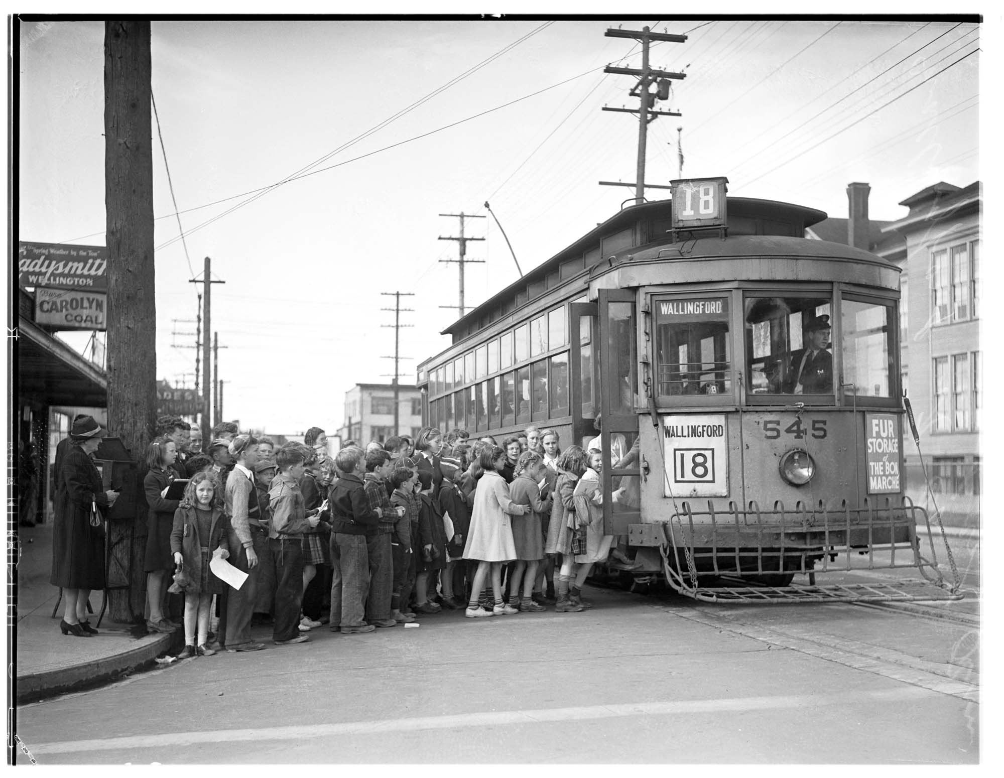 Image of Children boarding Wallingford streetcar on its last run, Seattle, 1940