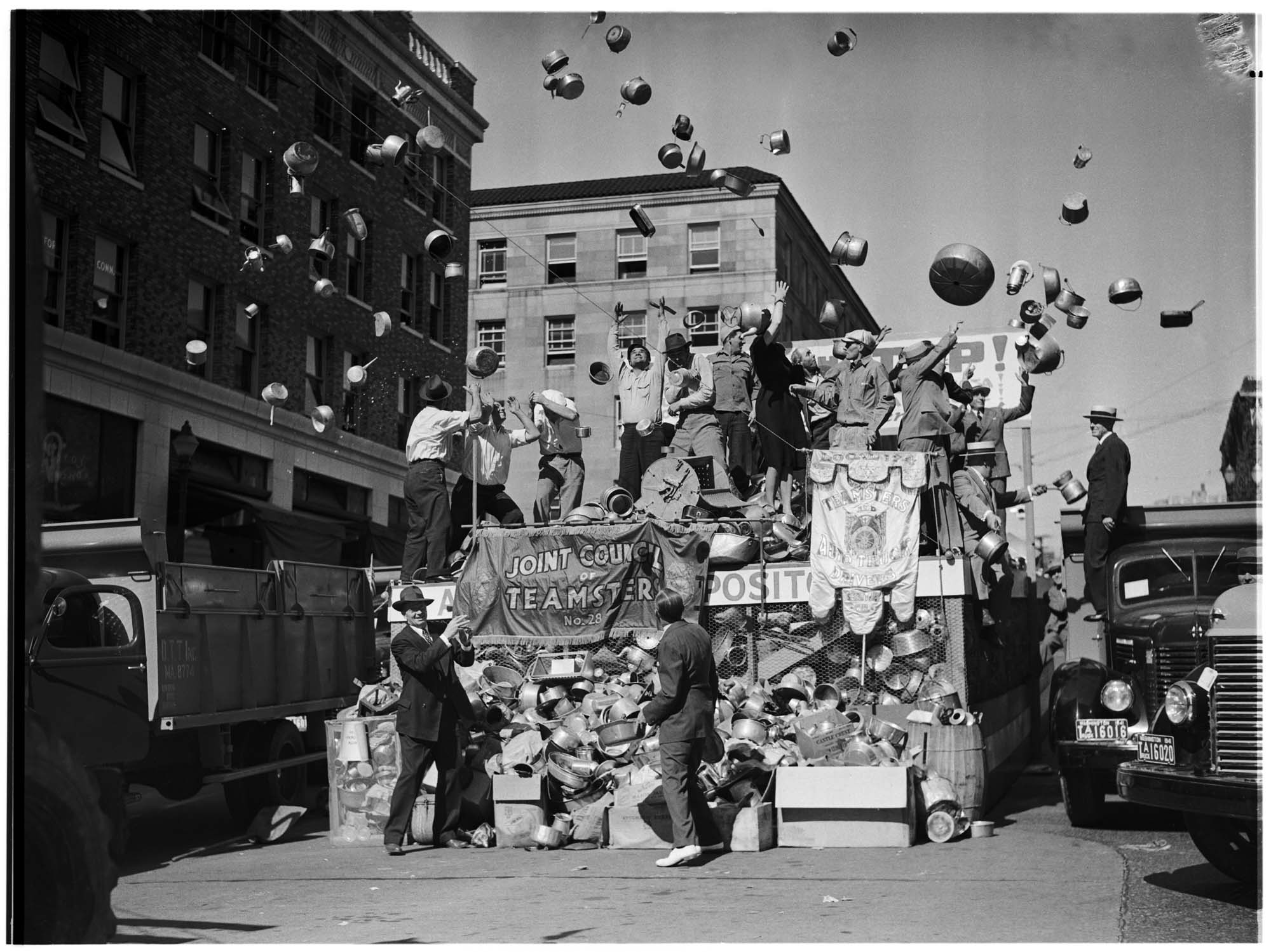 Image of Pots and pans flying through the air during scrap drive, July 1941