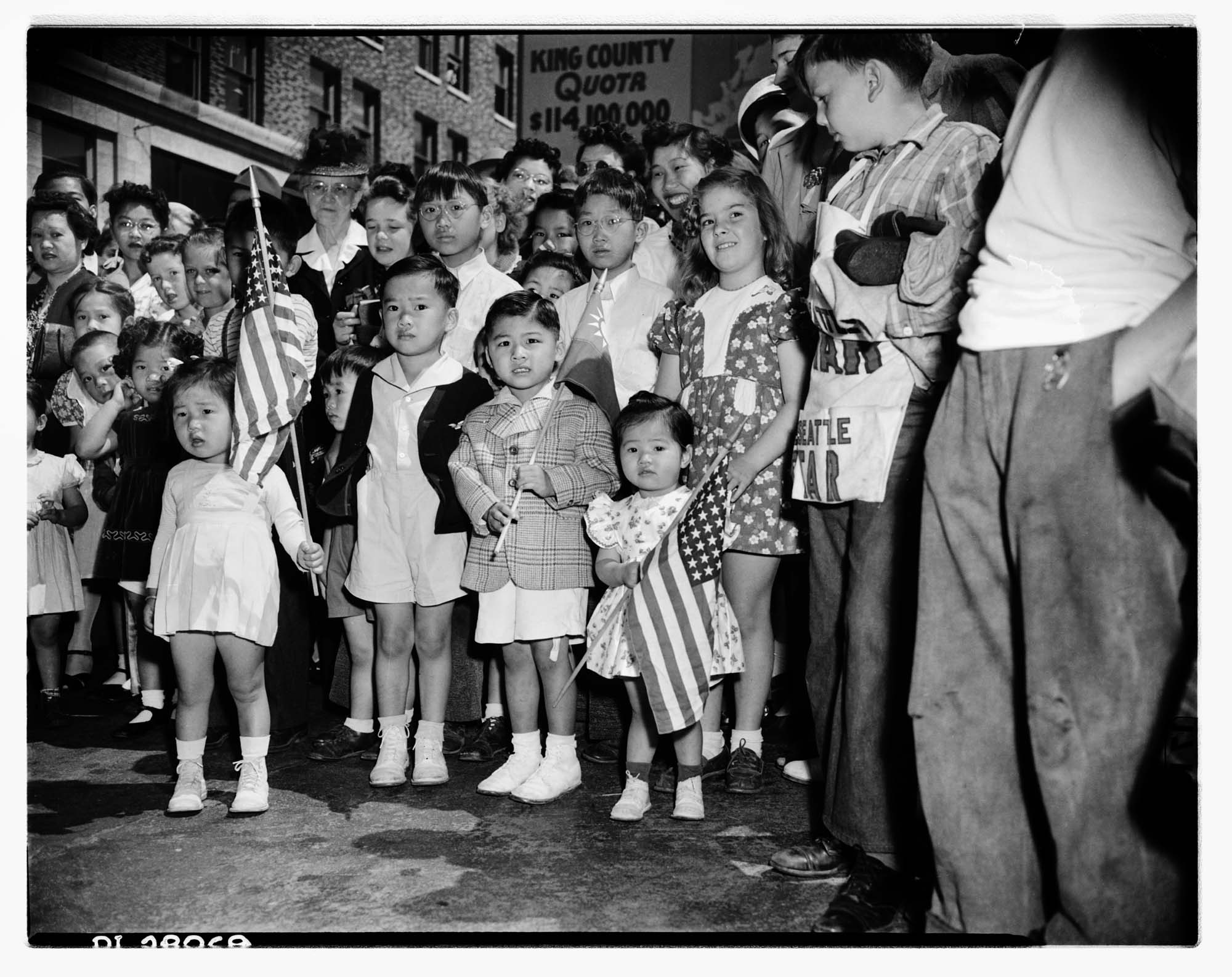 Image of Chinese American children with flags in Victory Square, Seattle, 1944