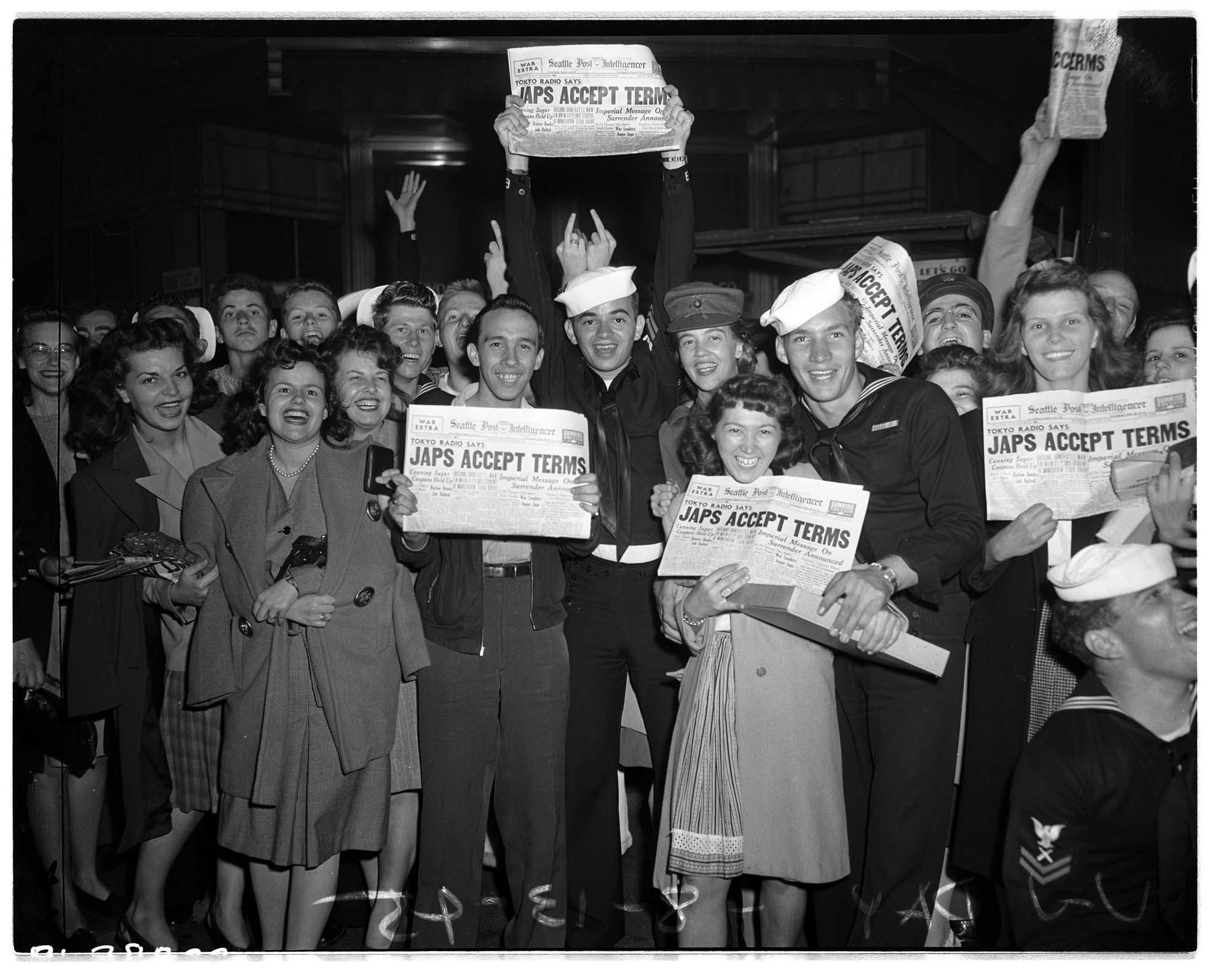 Image of Group displaying V-J Day newspapers, August 14, 1945