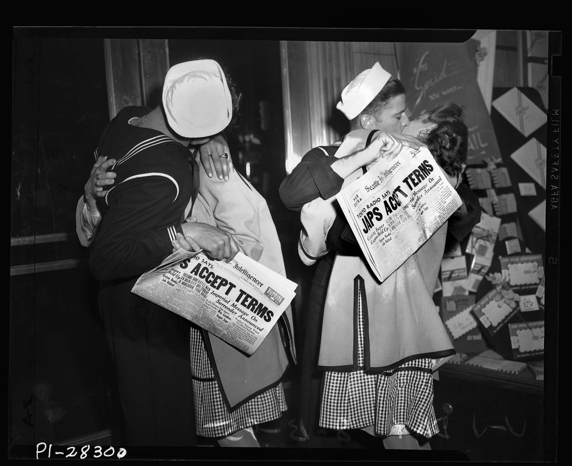 Image of Sailors kissing girls on V-J Day, Seattle, August 14, 1945
