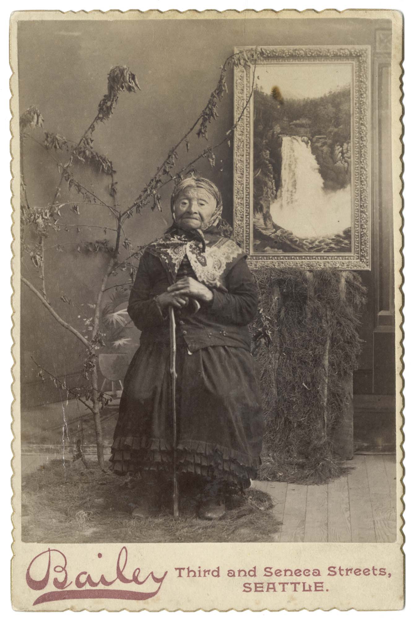 Image of Kikisoblu (Princess Angeline) with painting of Snoqualmie Falls, Seattle, 1890