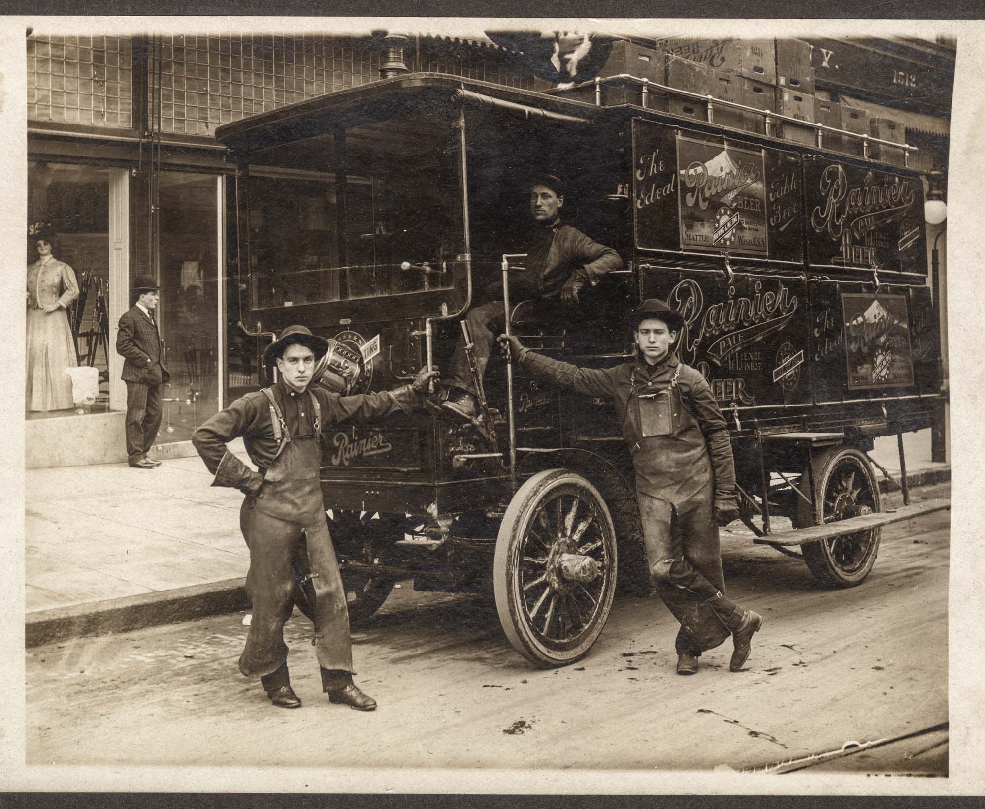 Image of Three delivery men with Rainier beer truck, 1905