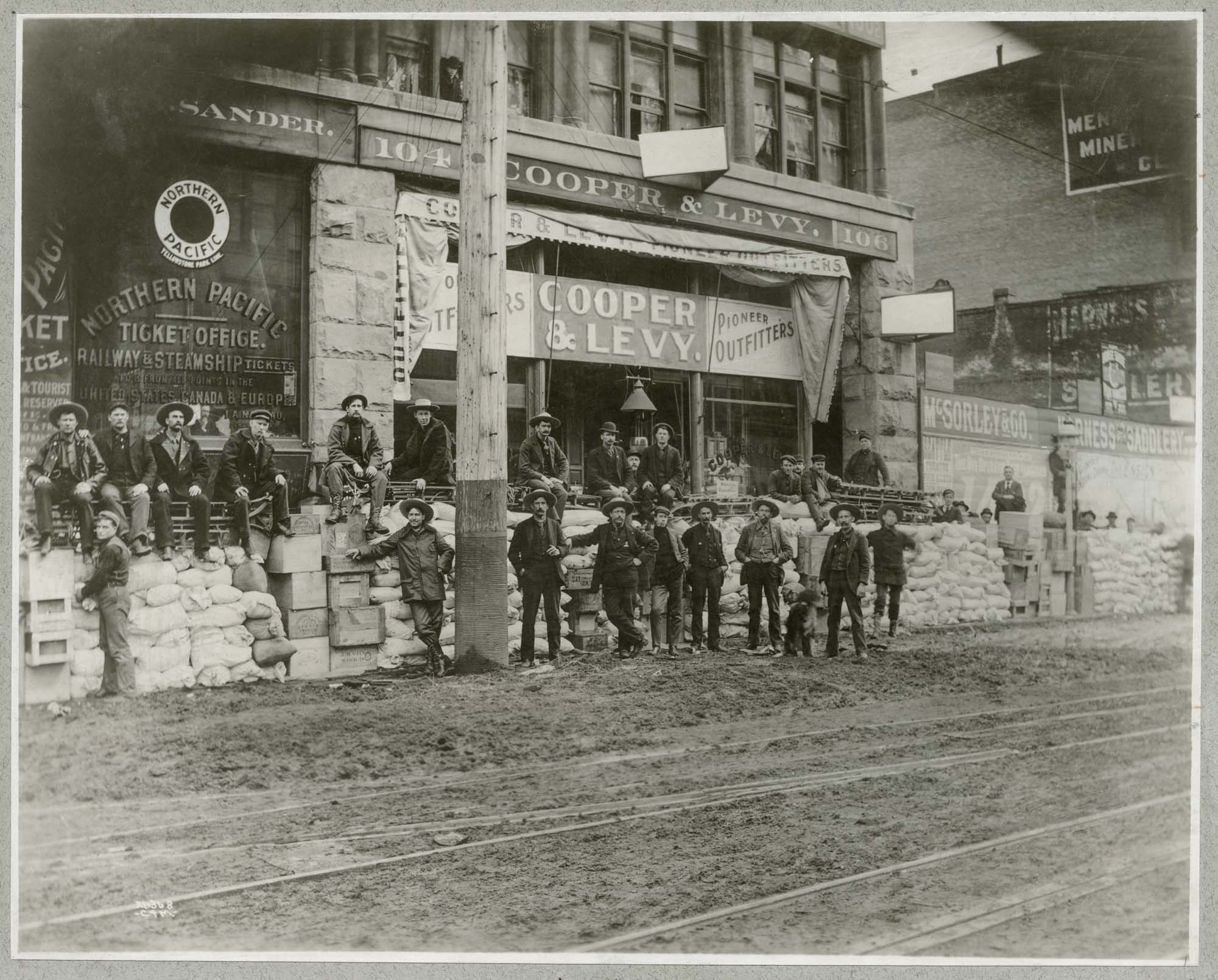 Image of Miners and supplies outside Cooper & Levy, circa 1897
