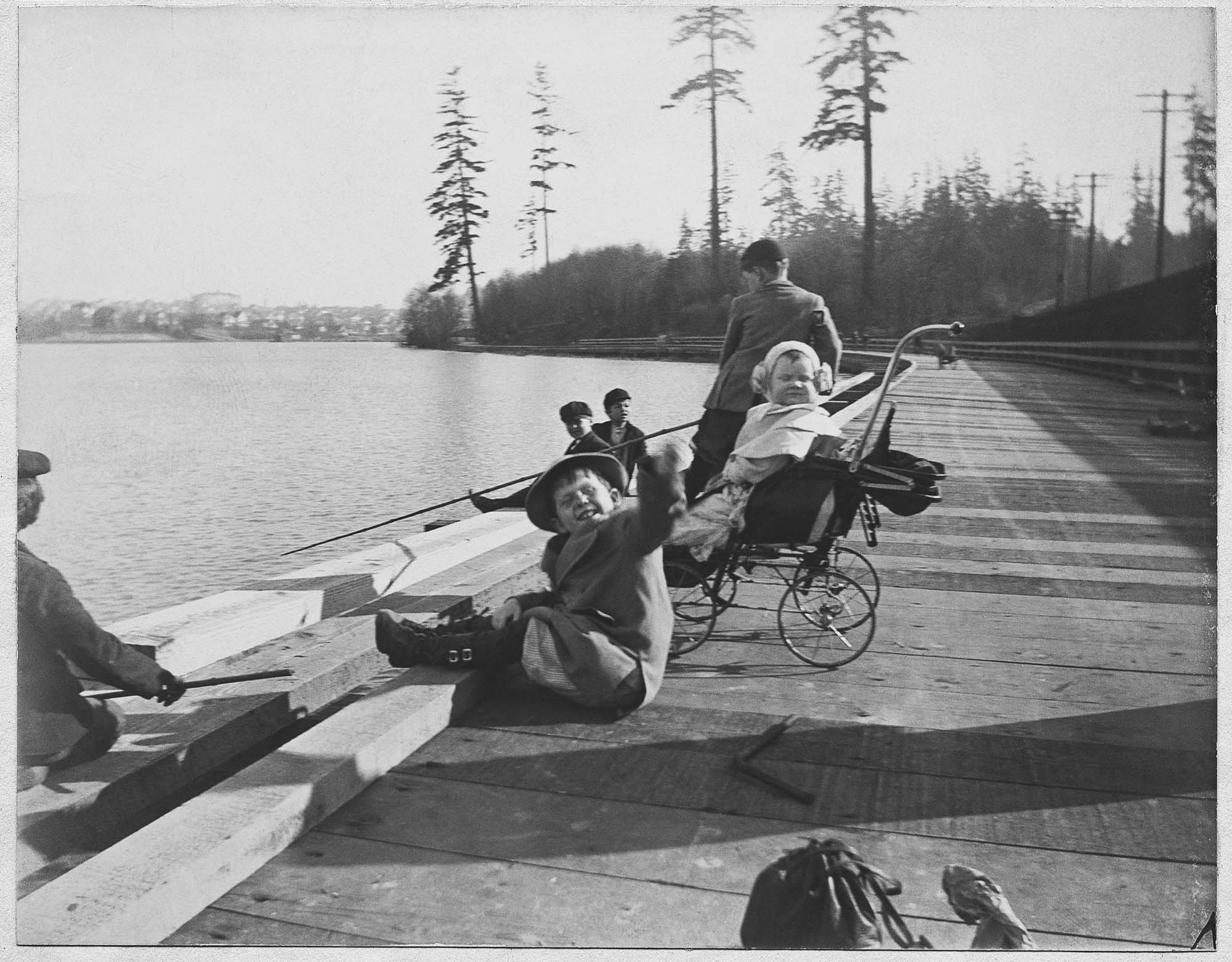 Image of Children fishing at Green Lake, Seattle, 1909