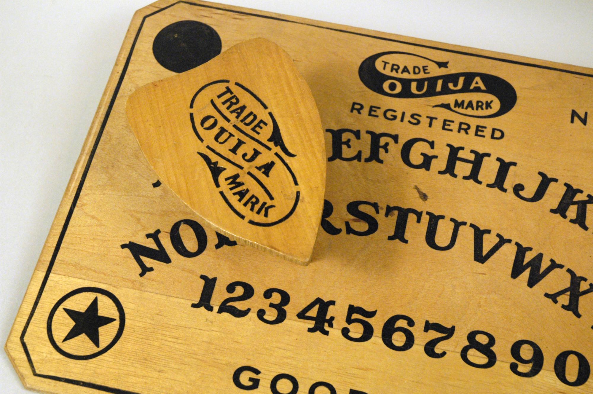 Image of Ouija board with pointer, ca. 1917