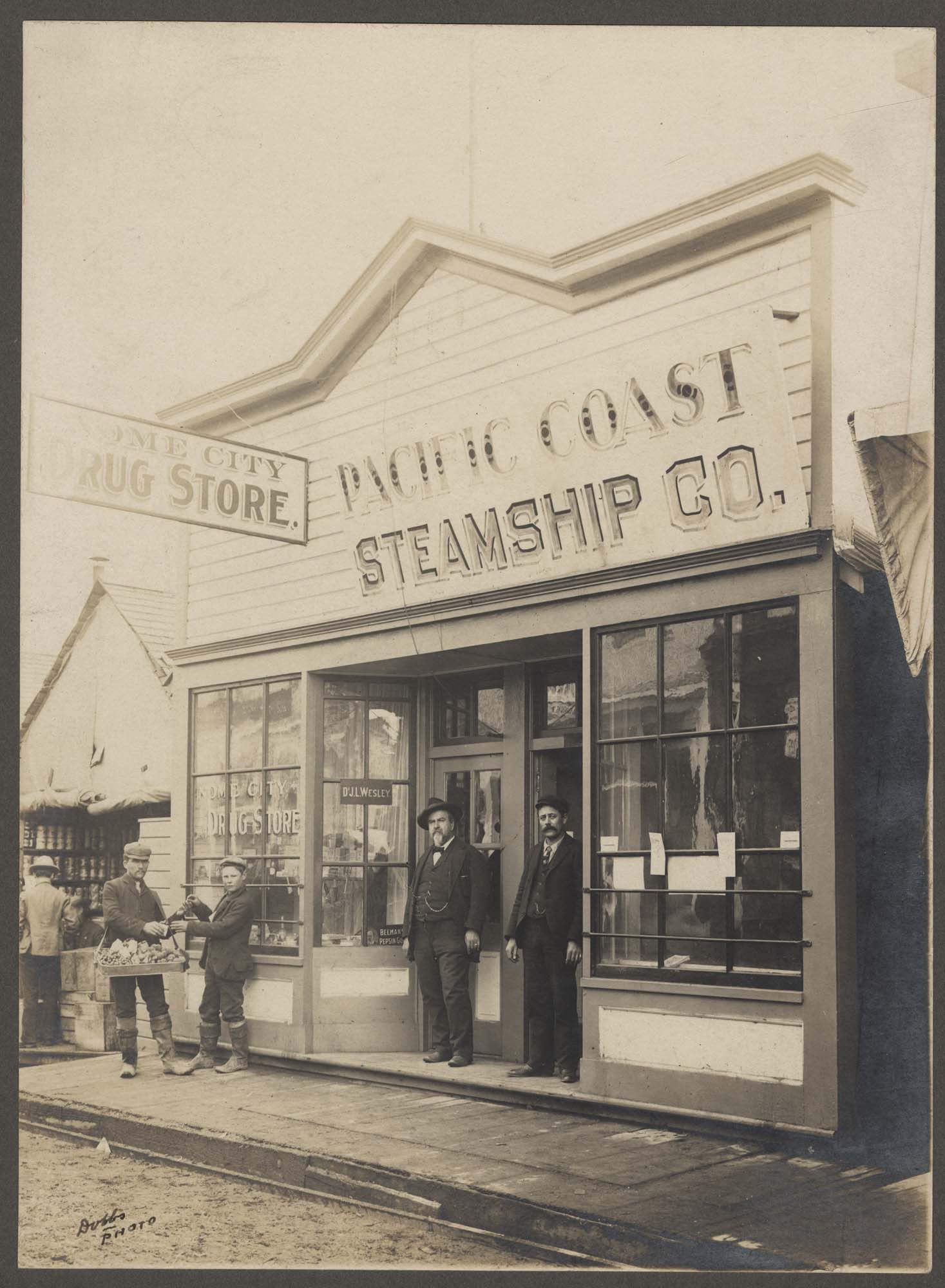 Image of Steamship office and drug store in Nome, Alaska, circa 1903