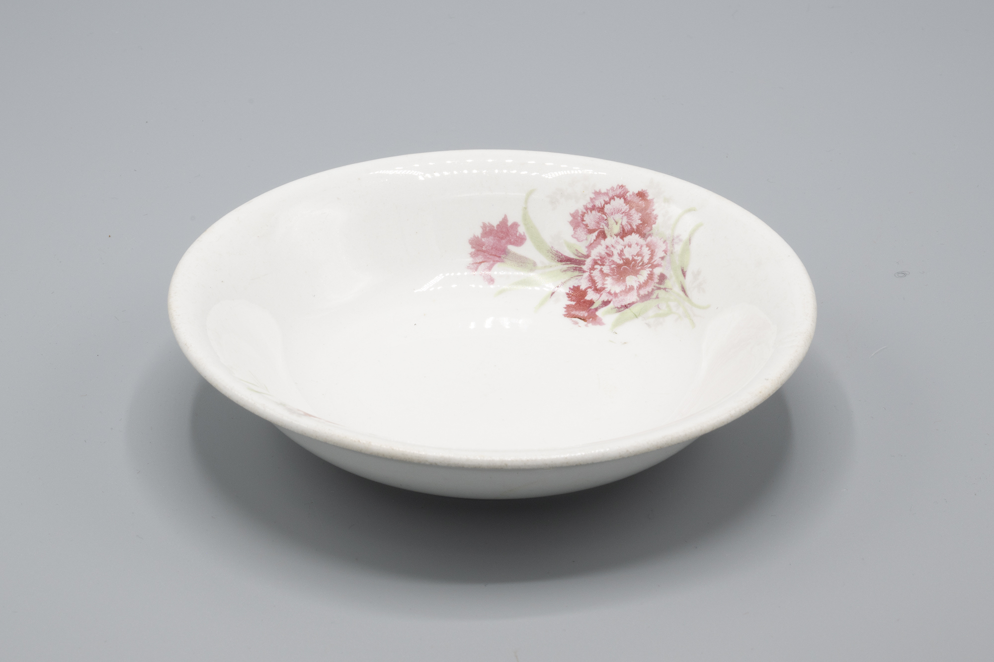 Image of China sauce dish, Carnation Company pattern, 1920-1930