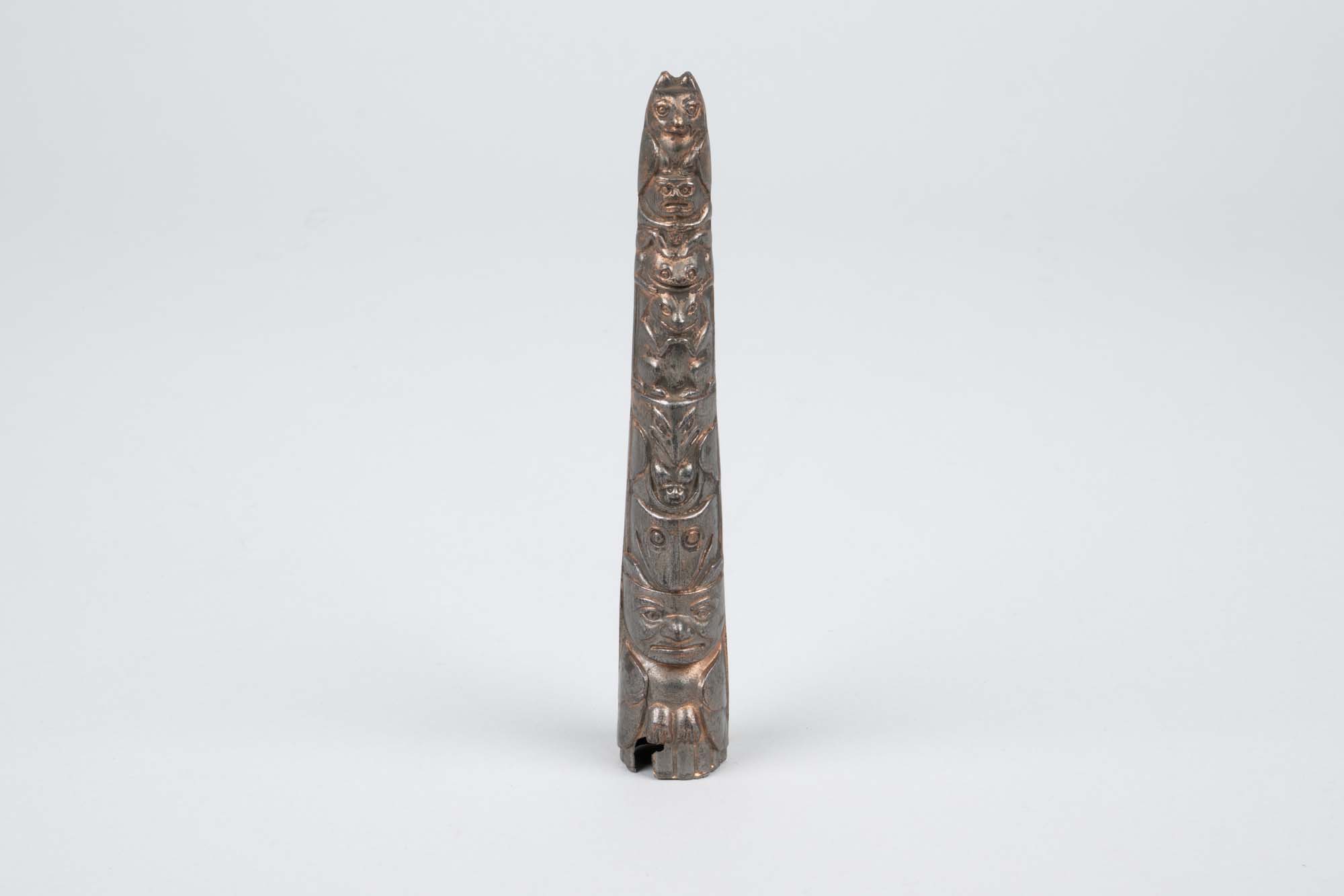 Image of Souvenir metal totem pole from the Golden Potlatch celebration, 1912