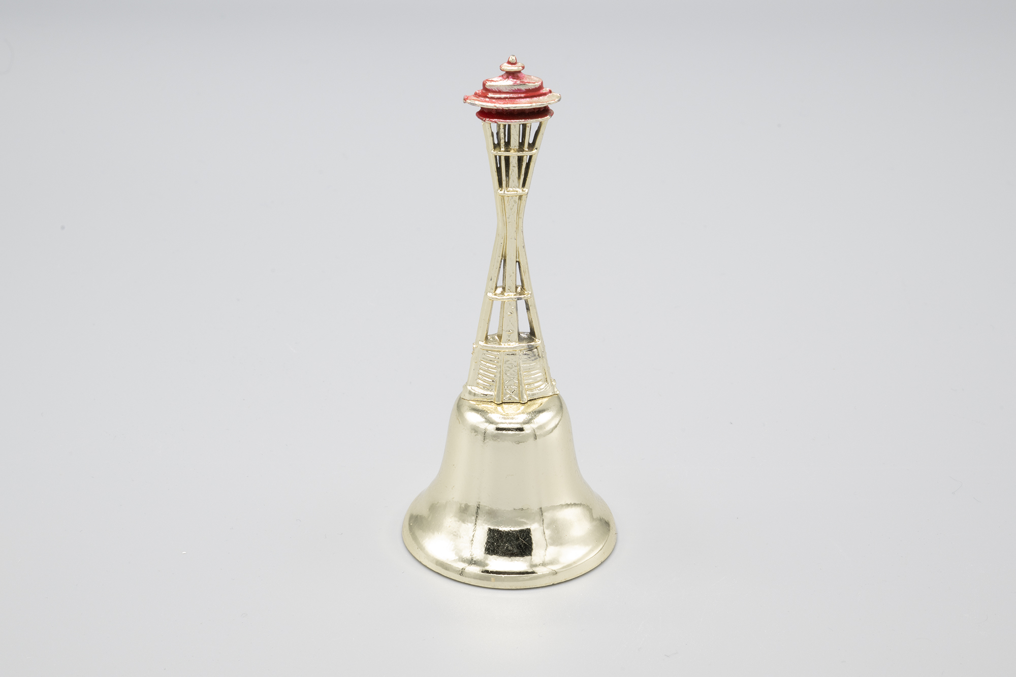 Image of Souvenir bell with Space Needle handle from the Seattle World's Fair, ca. 1962