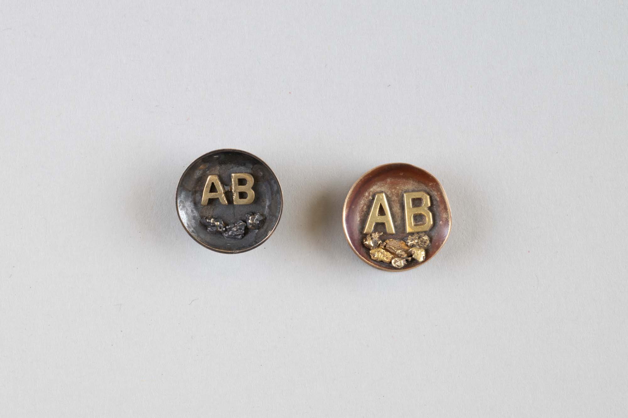 Image of Arctic Brotherhood (AB) studs from the Klondike Gold Rush, 1899