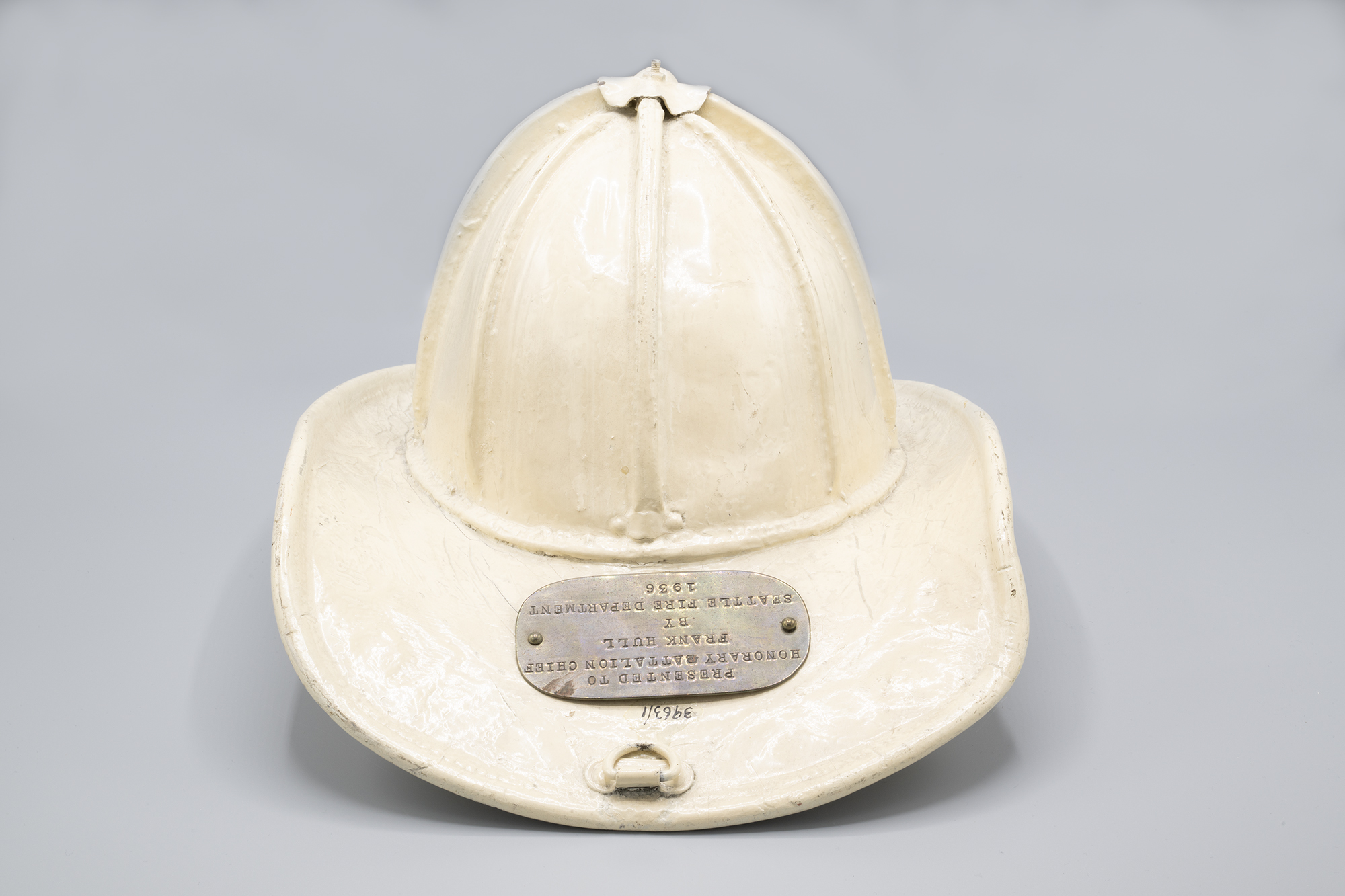 Image of Chief Battalion 7 fireman's helmet presented to Olympic Hotel manager Frank Hull, 1936