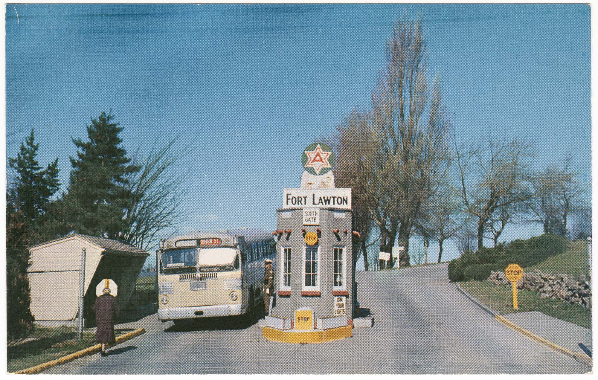 Image of Bus driving through south gate at Fort Lawton, Seattle, circa 1960