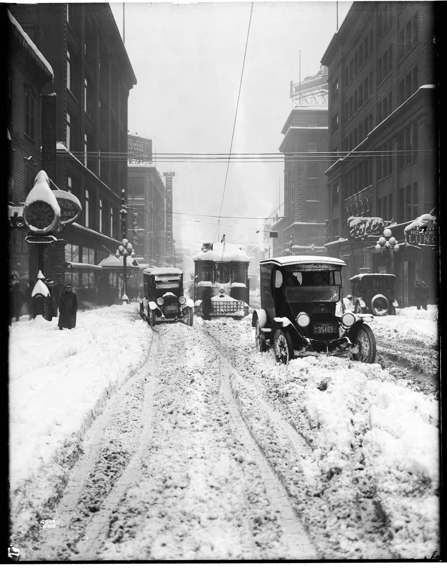 Image of Cars and streetcar stuck in snow on Pike Street, Seattle, 1916