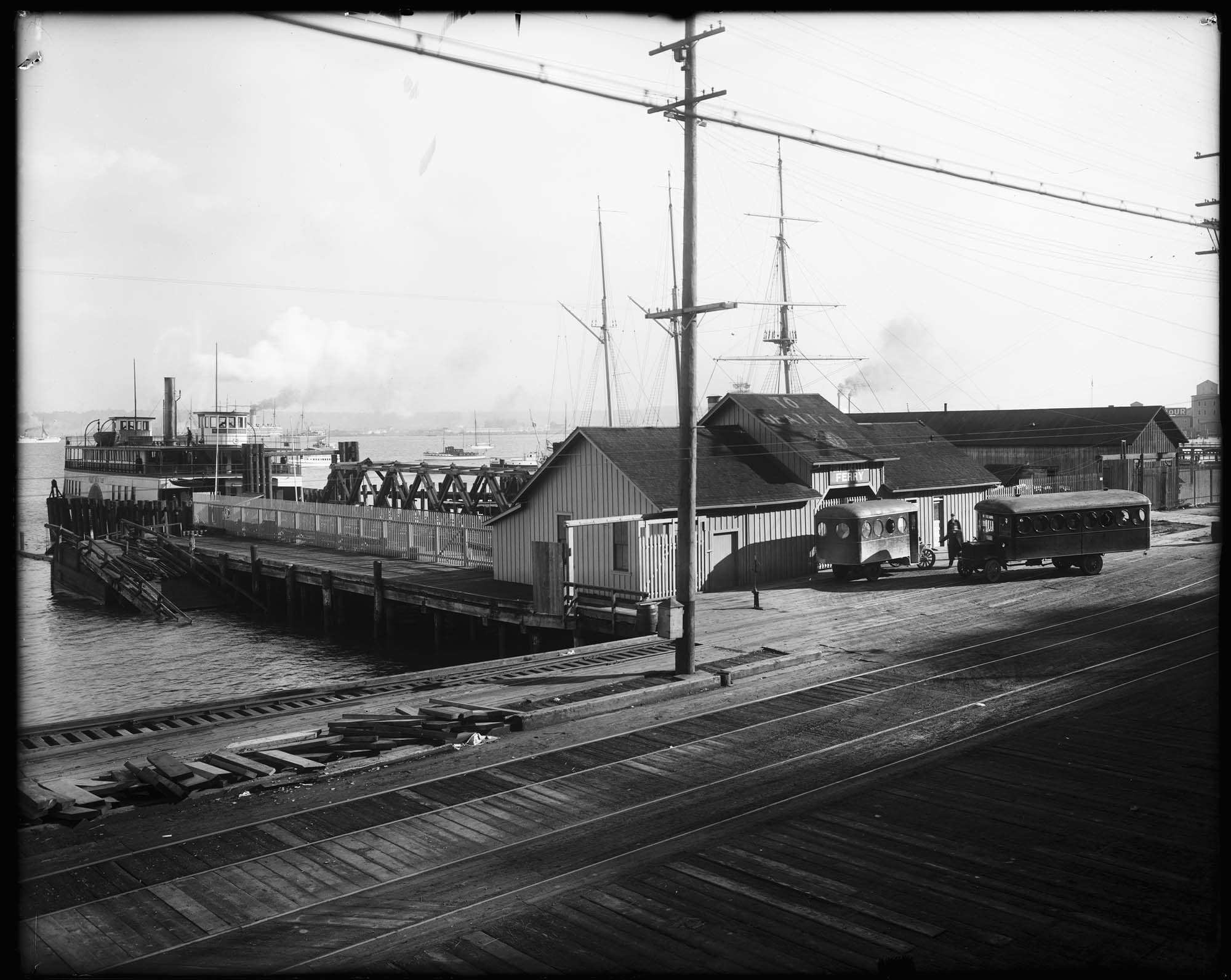 Image of Buses at West Seattle ferry dock, circa 1920