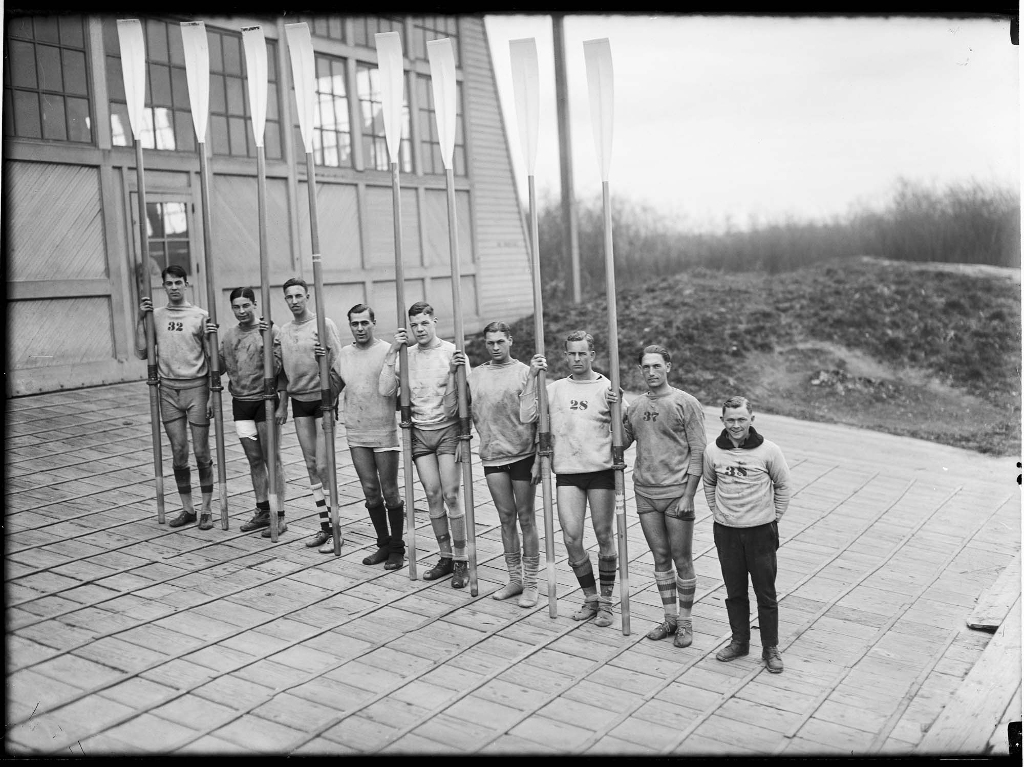 Image of University of Washington varsity crew team in front of shellhouse, Seattle, 1924