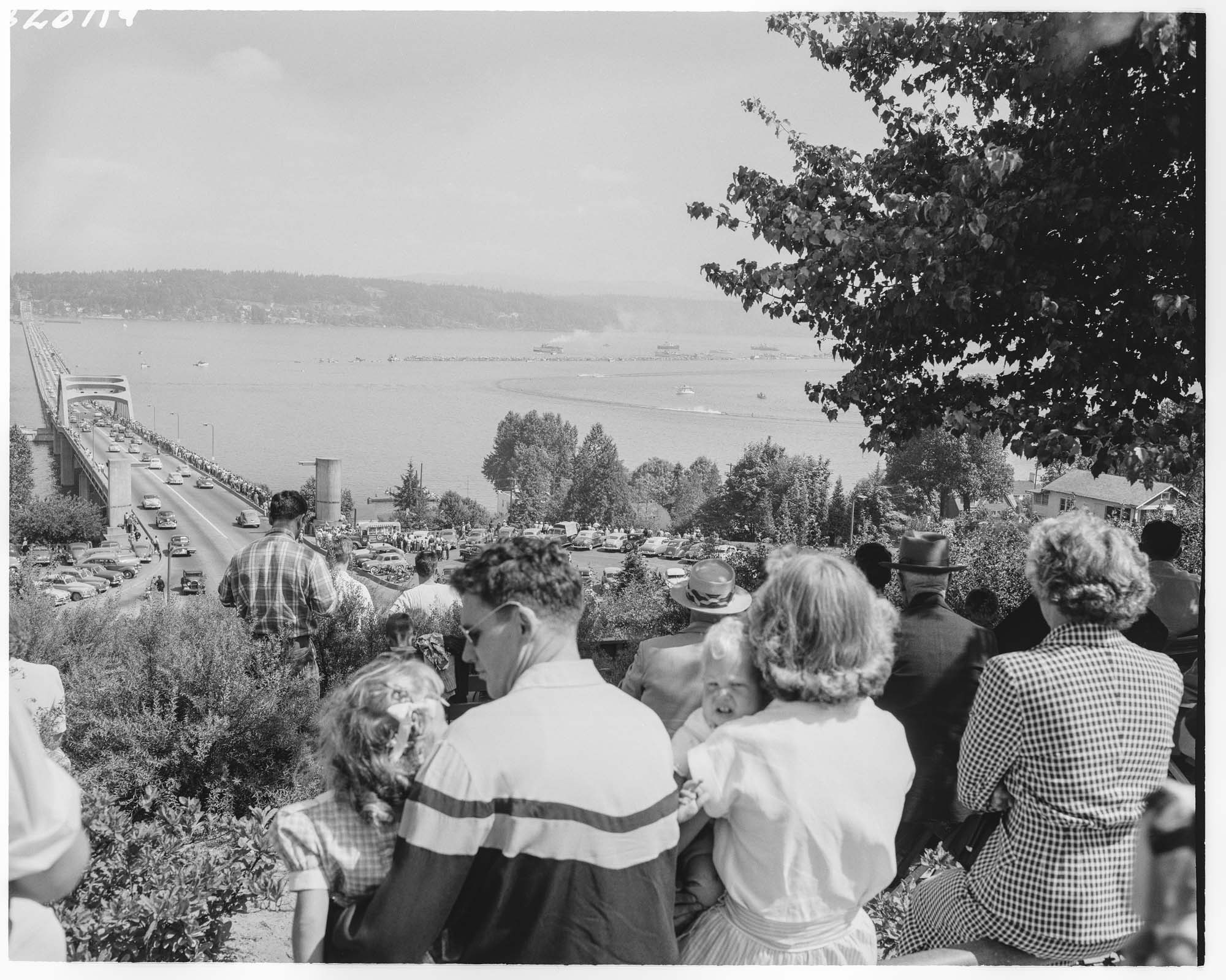 Image of Crowd watching Seafair hydroplane races from above Lake Washington floating bridge, Seattle, 1952