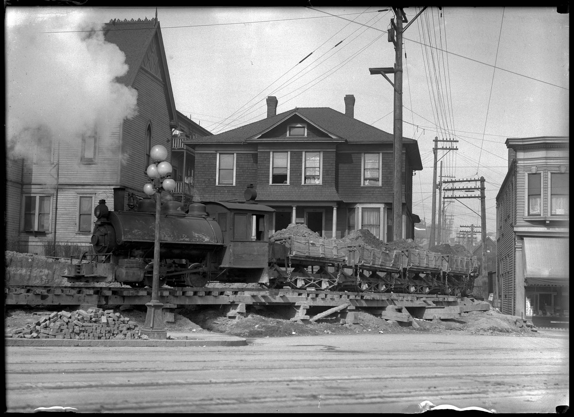 Image of Regrade dirt train, circa 1913